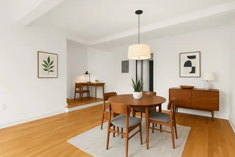 a dining room with furniture and window