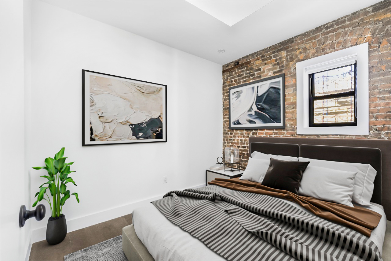 346 West 52nd Street, Unit 5D Manhattan, NY 10019 - Photo 3 of 7 a bedroom with furniture and a potted plant