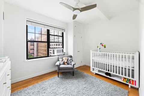 a bedroom with furniture and a window