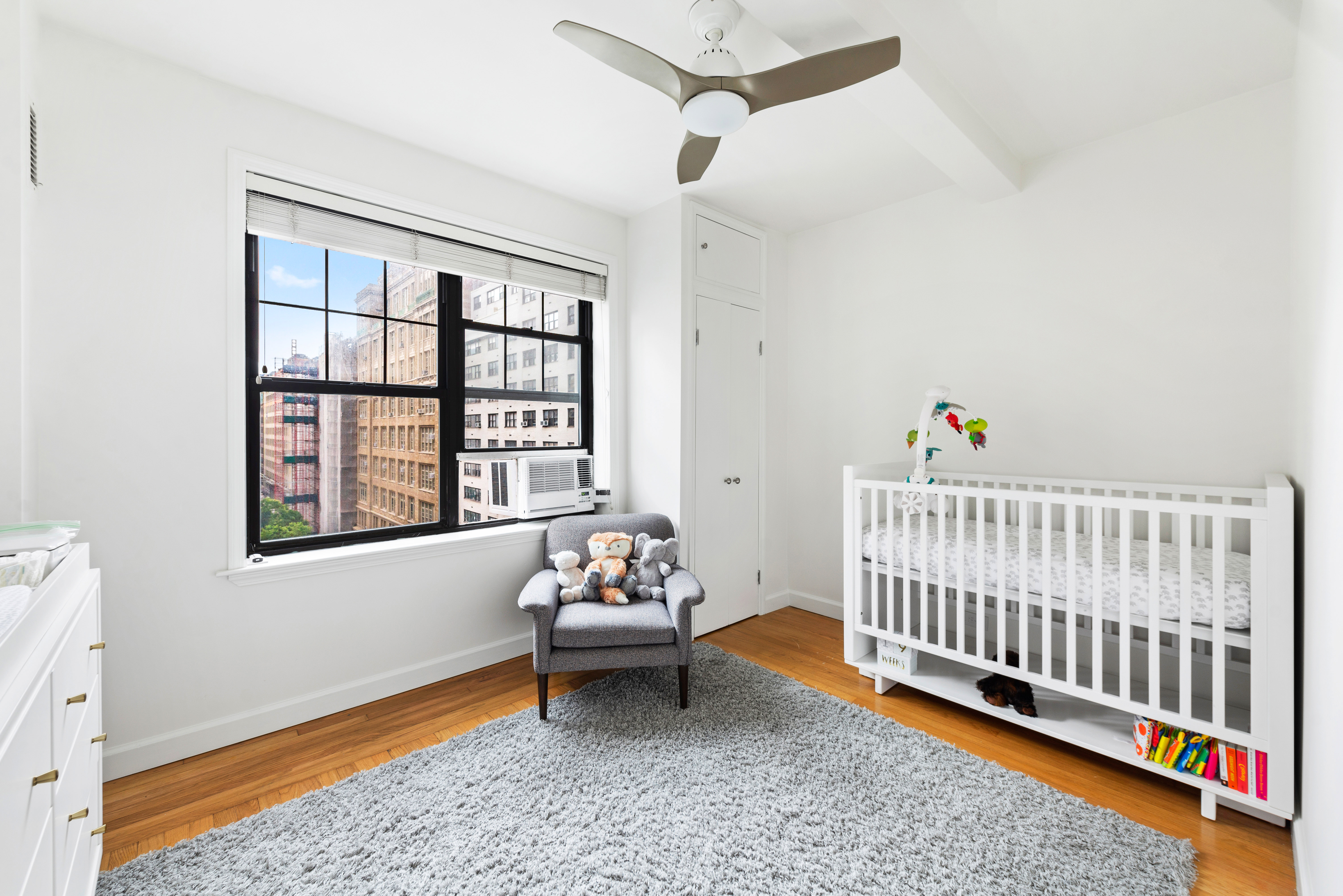 200 East 16th Street, Unit 11GH Manhattan, NY 10003 - Photo 4 of 8 a bedroom with furniture and a window