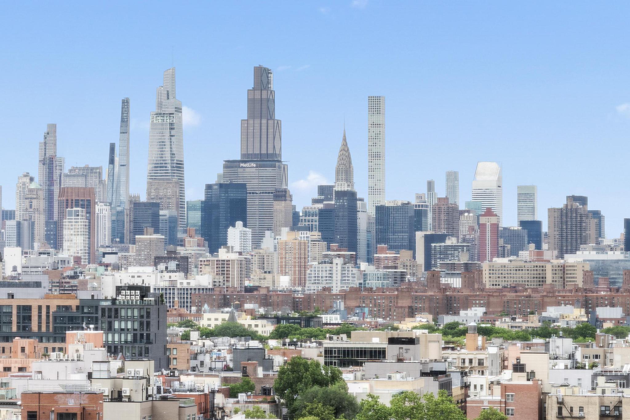 266 East Broadway, Unit 1304B Manhattan, NY 10002 - Photo 7 of 8 a city view with lot of high rise buildings