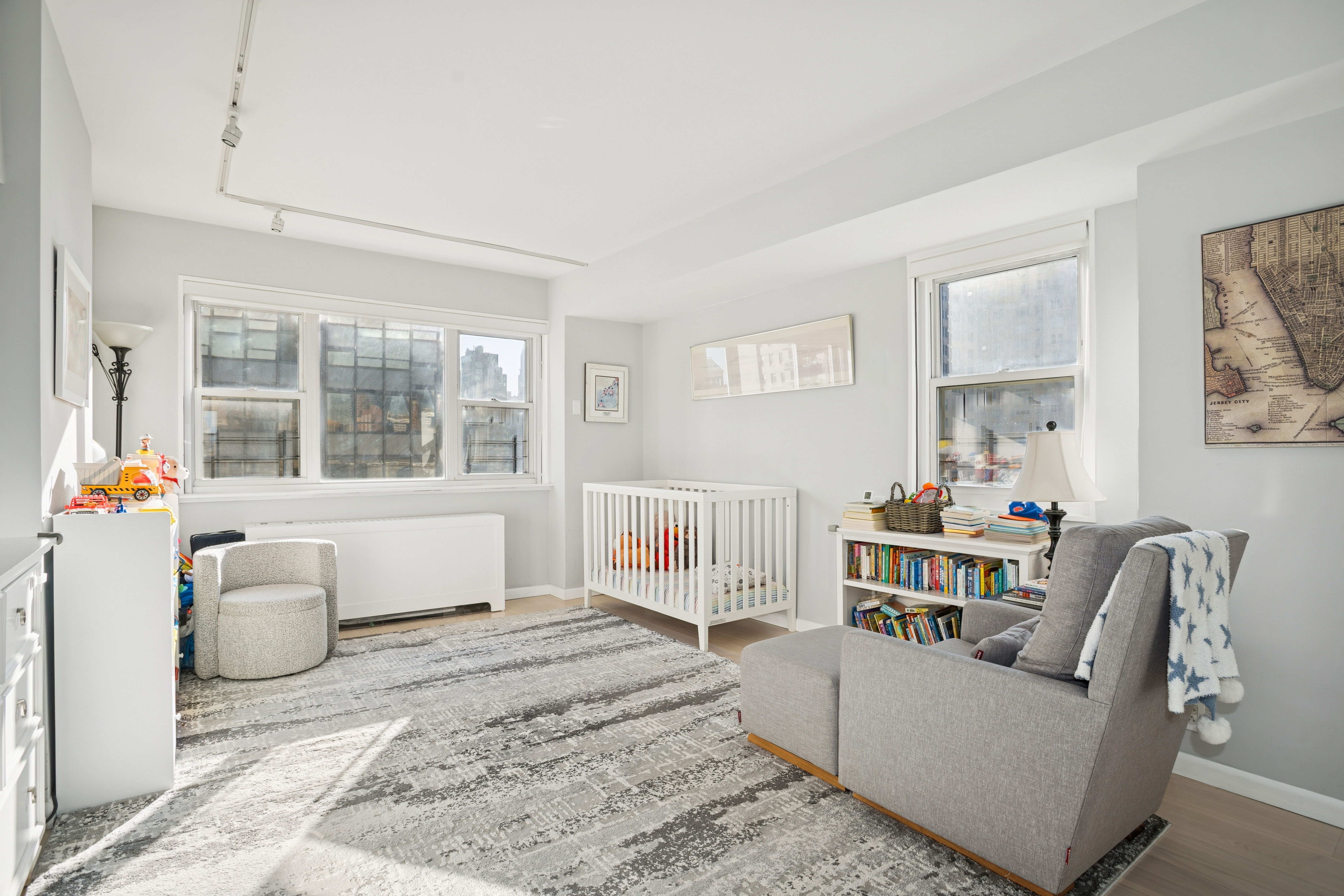 345 East 56th Street, Unit 21F Manhattan, NY 10022 - Photo 6 of 15 a living room with furniture and a window