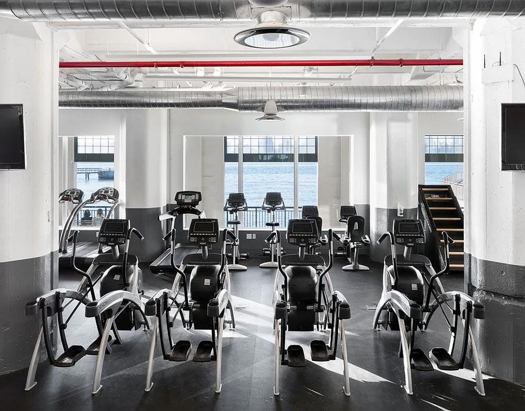184 Kent Avenue, Unit D519 Brooklyn, NY 11249 - Photo 13 of 17 a gym with equipment