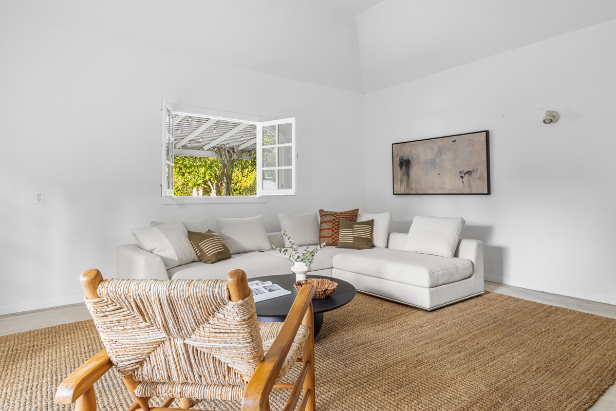 926 Burnside Avenue Los Angeles, CA 90036 - Photo 49 of 71 a living room with furniture and a wooden floor
