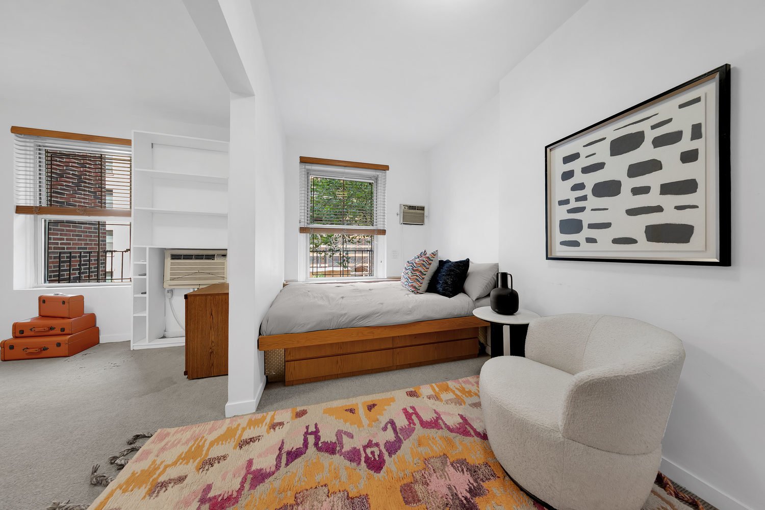 206 East 30th Street Manhattan, NY 10016 - Photo 12 of 17 a bedroom with furniture and a fireplace