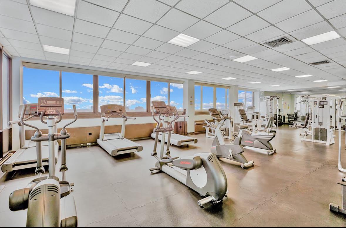 155 East 29th Street, Unit 7D Manhattan, NY 10016 - Photo 6 of 8 a lots of gym equipment