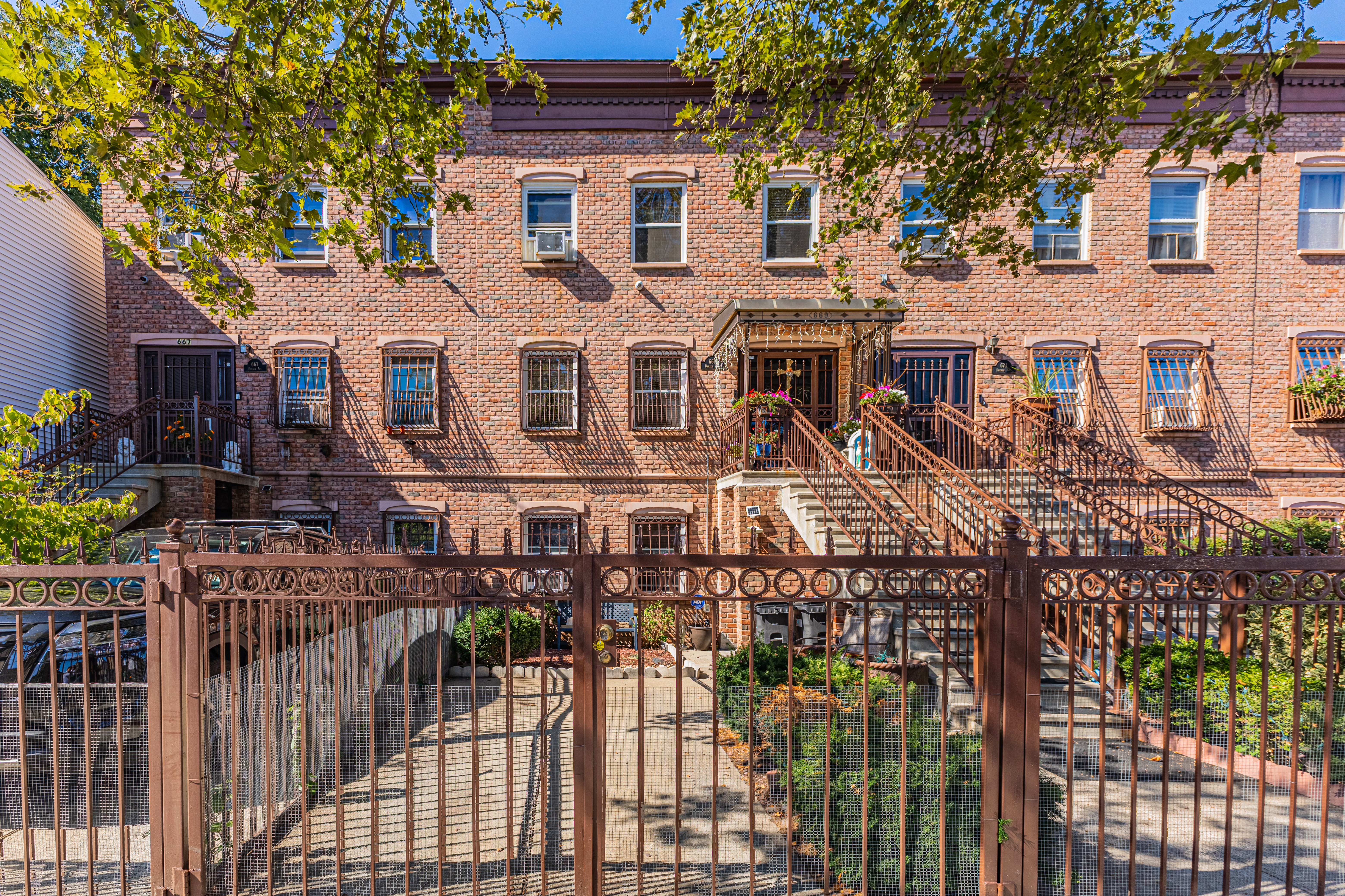669 Dekalb Avenue Brooklyn, NY 11216 - Photo 2 of 21 a front view of a house with glass windows