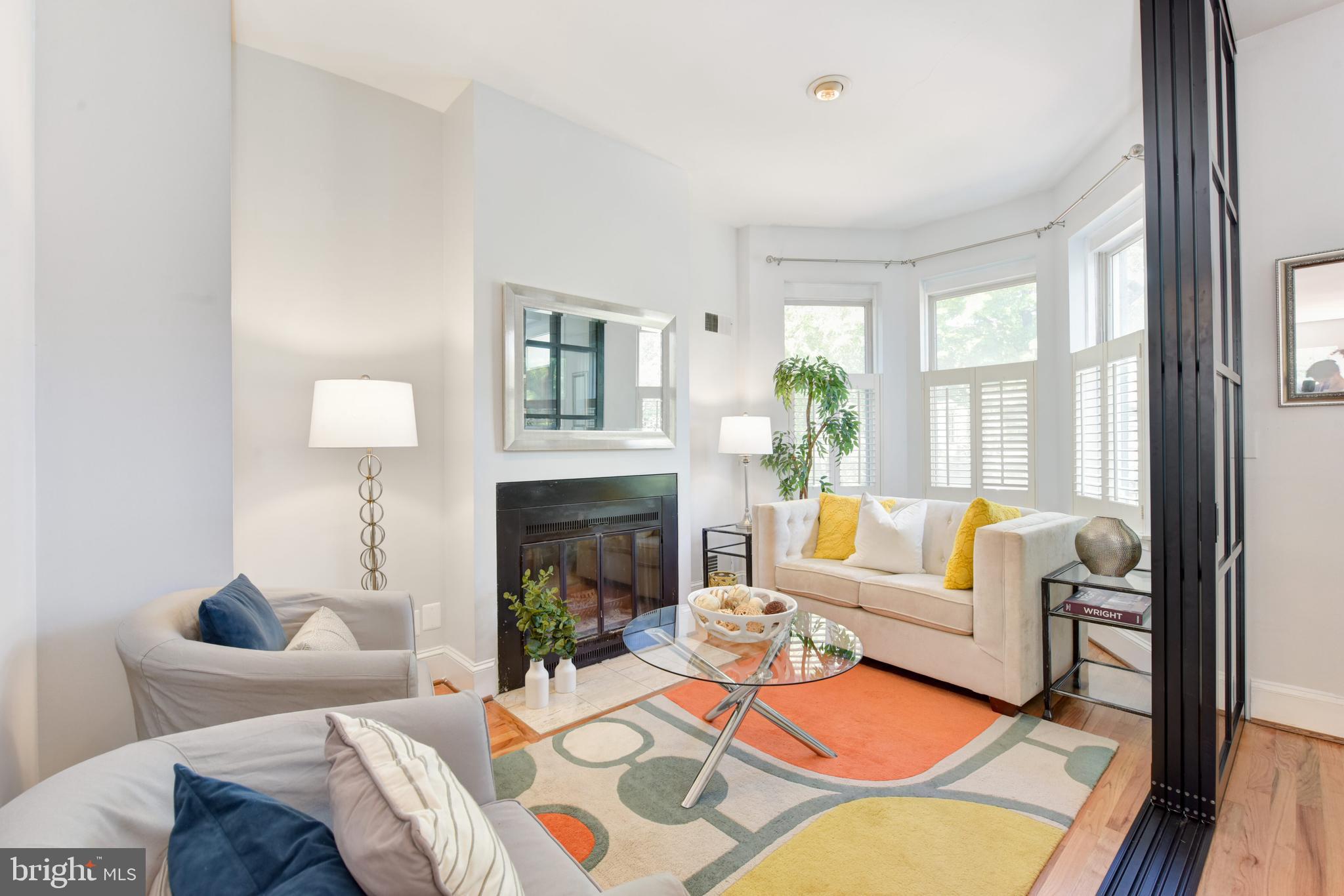 629 5th Street Northeast Washington, DC 20002 - Photo 4 of 31 a living room with furniture fireplace and a large window