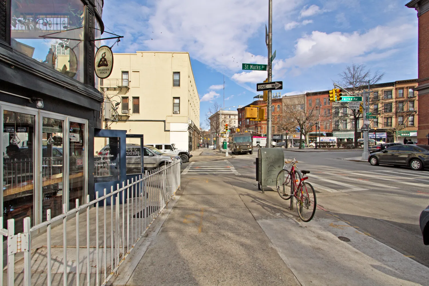 a view of a street with sitting area