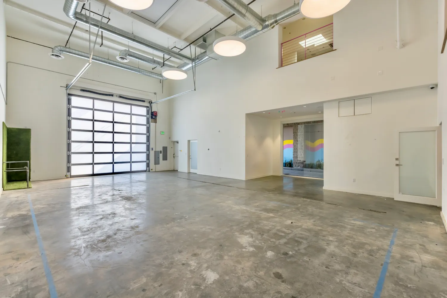 a view of a room with wooden floor and windows
