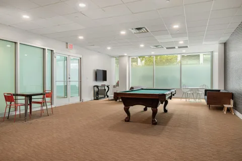 a room with furniture and a large window