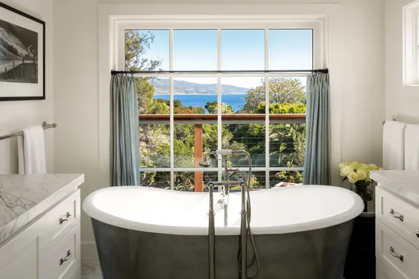 a view of a livingroom with furniture and a ceiling fan