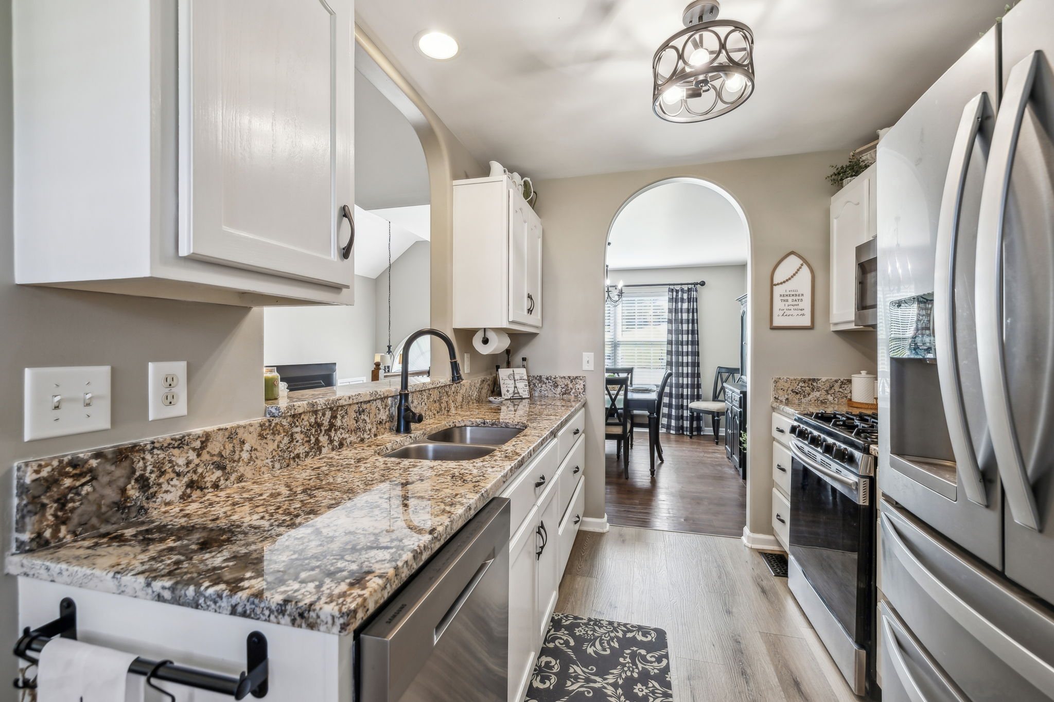 405 Billy Lane Spring Hill, TN 37174 - Photo 16 of 39 a kitchen with kitchen island granite countertop a stove and a sink