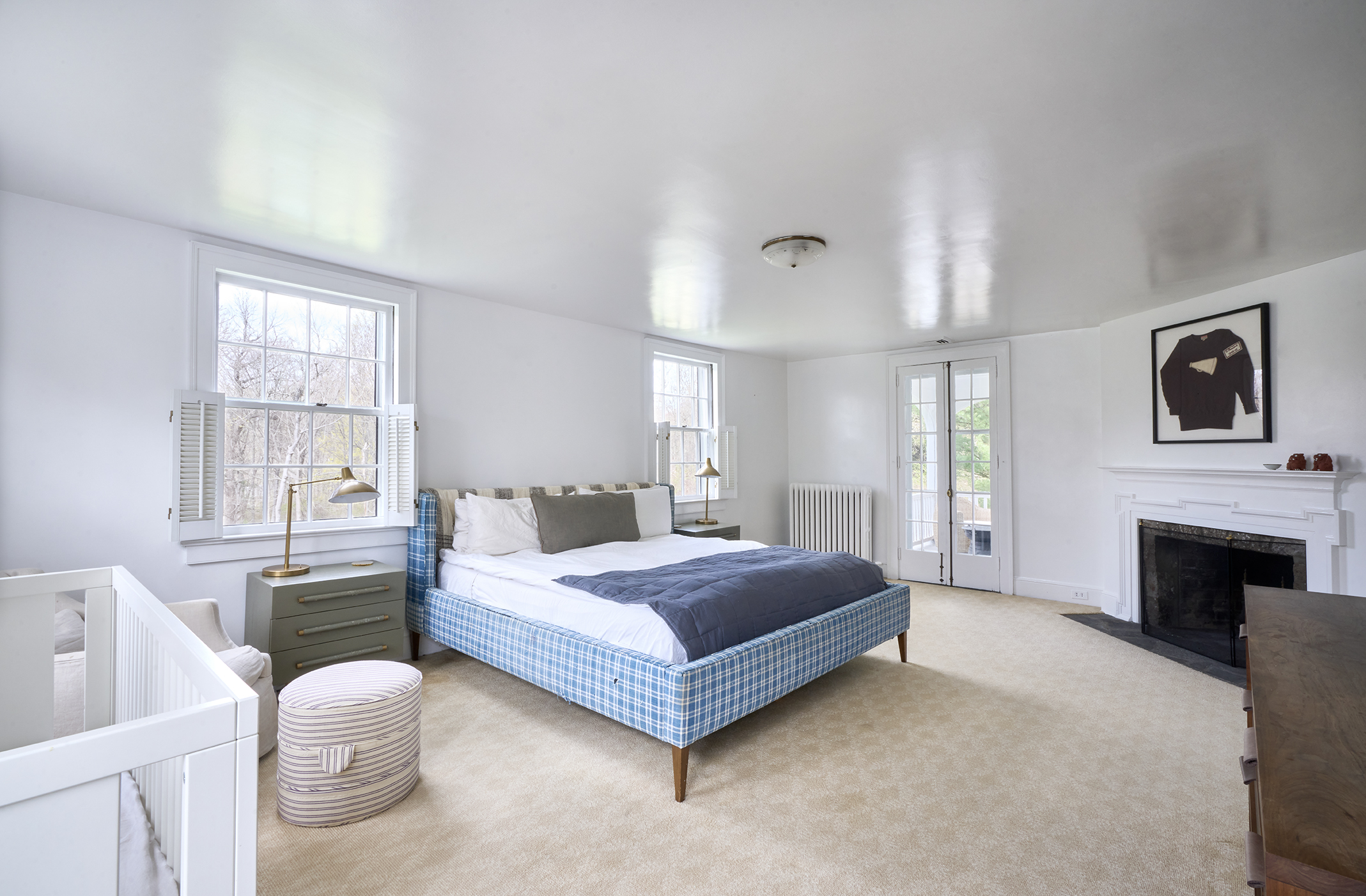 89 Chestnut Hill Road Wilton, CT 06897 - Photo 9 of 12 a bedroom with a bed couch and windows