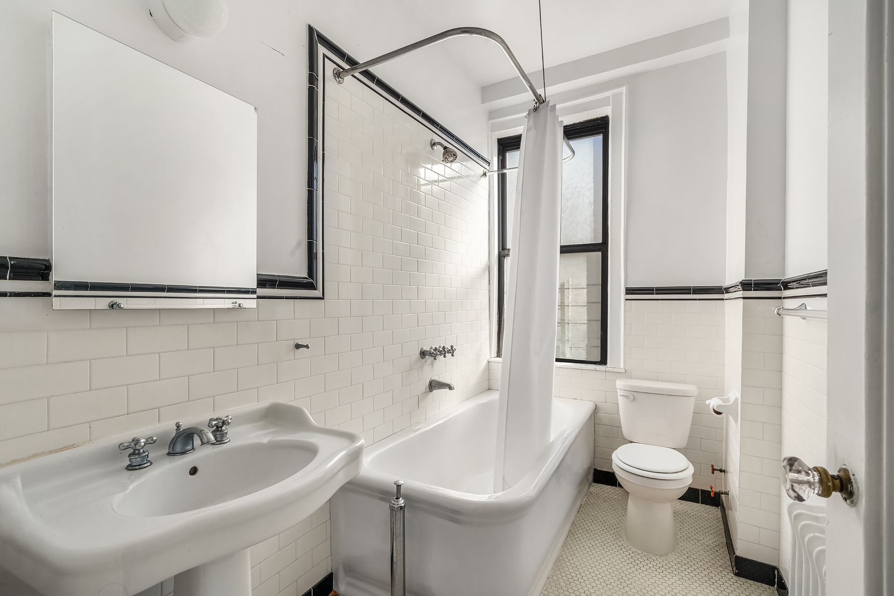 885 West End Avenue, Unit 8A Manhattan, NY 10025 - Photo 9 of 12 a bathroom with a toilet a sink and a bathtub