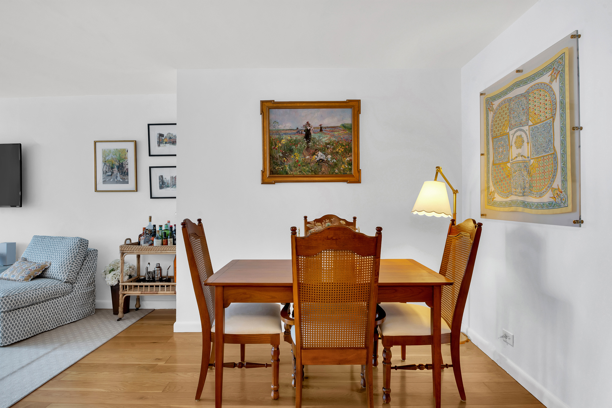 275 Greenwich Street, Unit 11J Manhattan, NY 10007 - Photo 4 of 9 a dining room with furniture and wooden floor