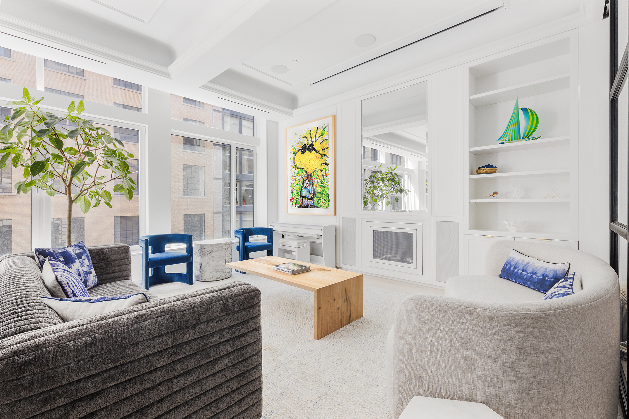 26 West 20th Street, Unit 3 Manhattan, NY 10011 - Photo 1 of 19 a living room with furniture and a potted plant