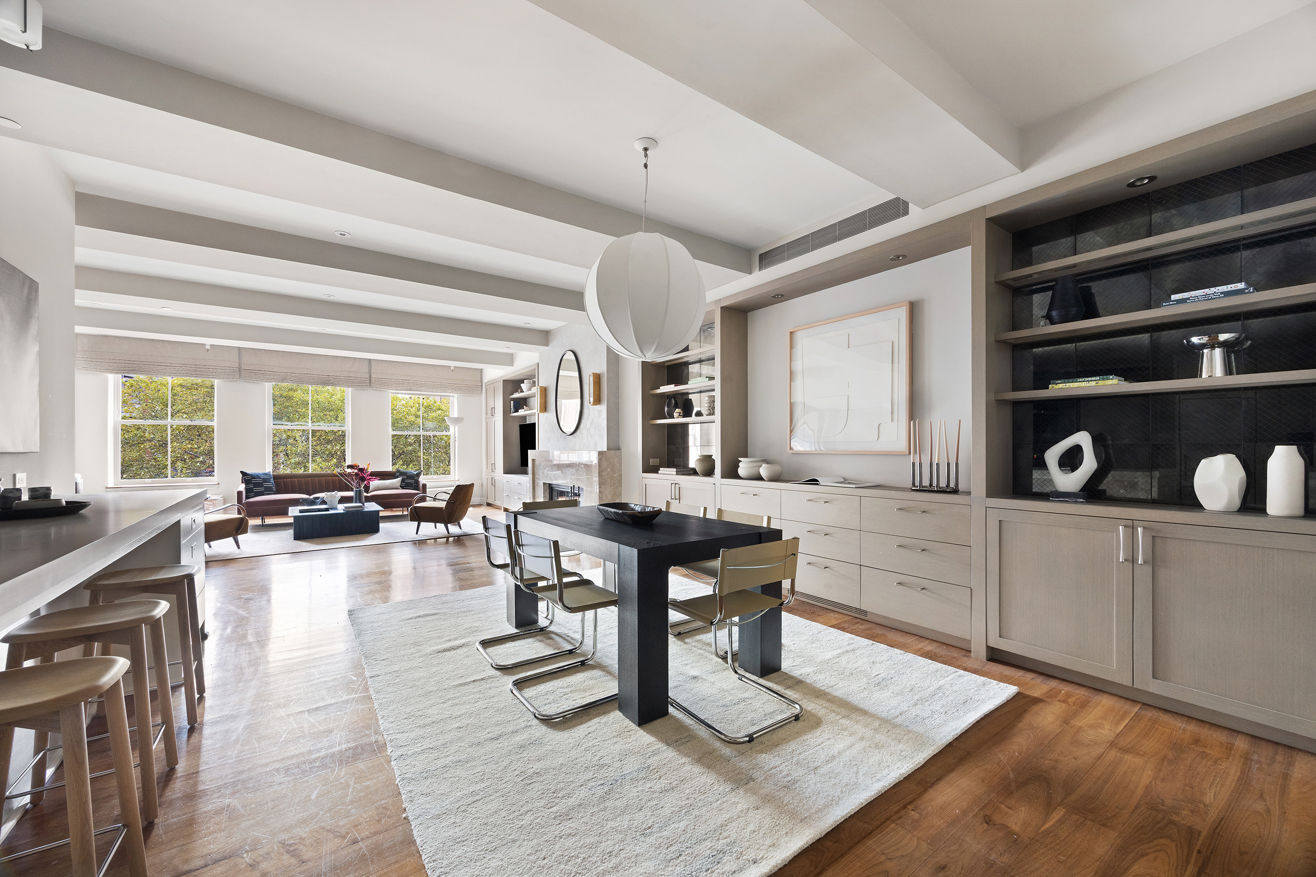 161 Duane Street, Unit 4B Manhattan, NY 10013 - Photo 2 of 16 a living room with furniture a rug and a window