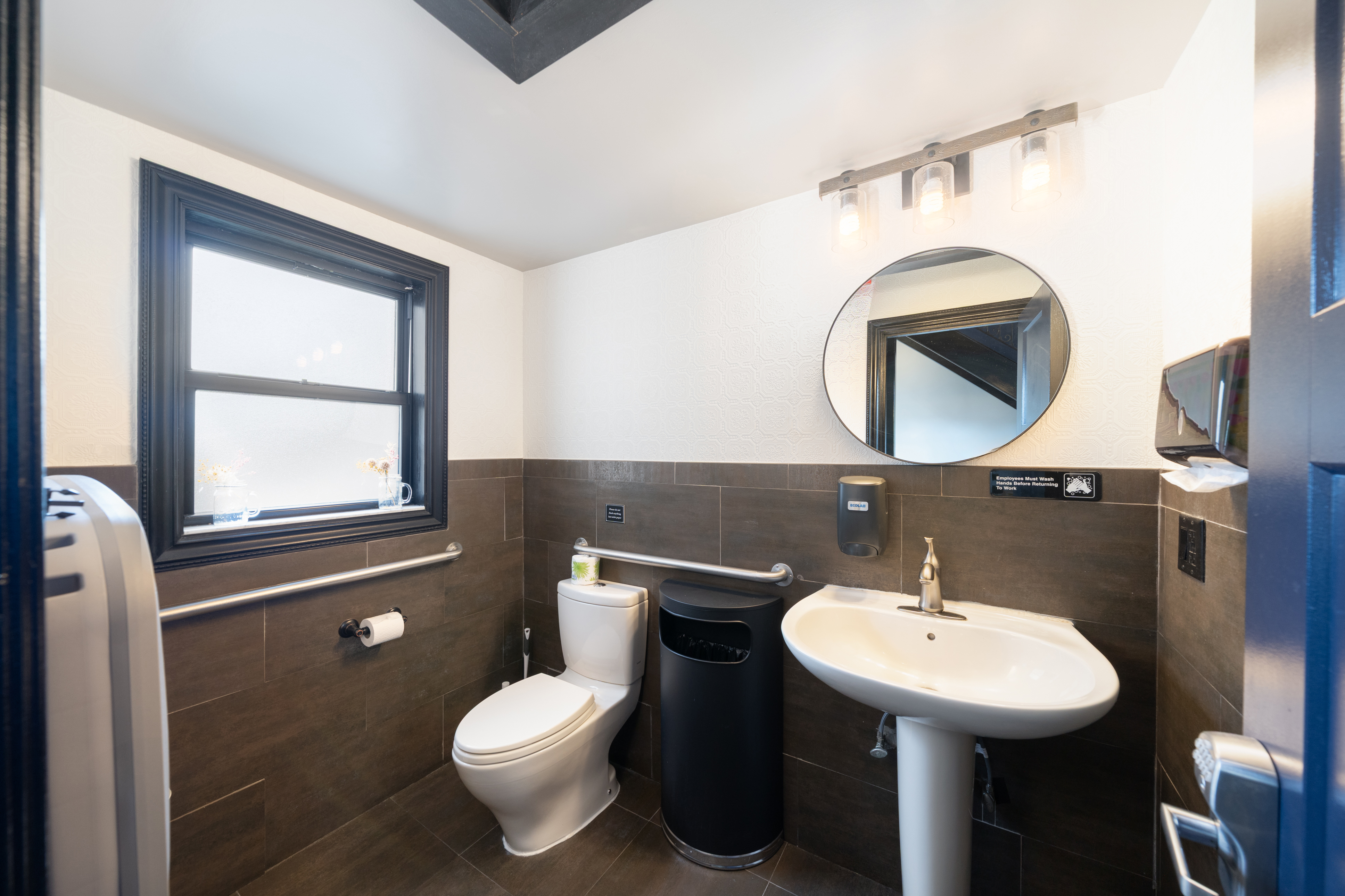 155 3rd Street Hoboken, NJ 07030 - Photo 13 of 18 a bathroom with a toilet sink and mirror