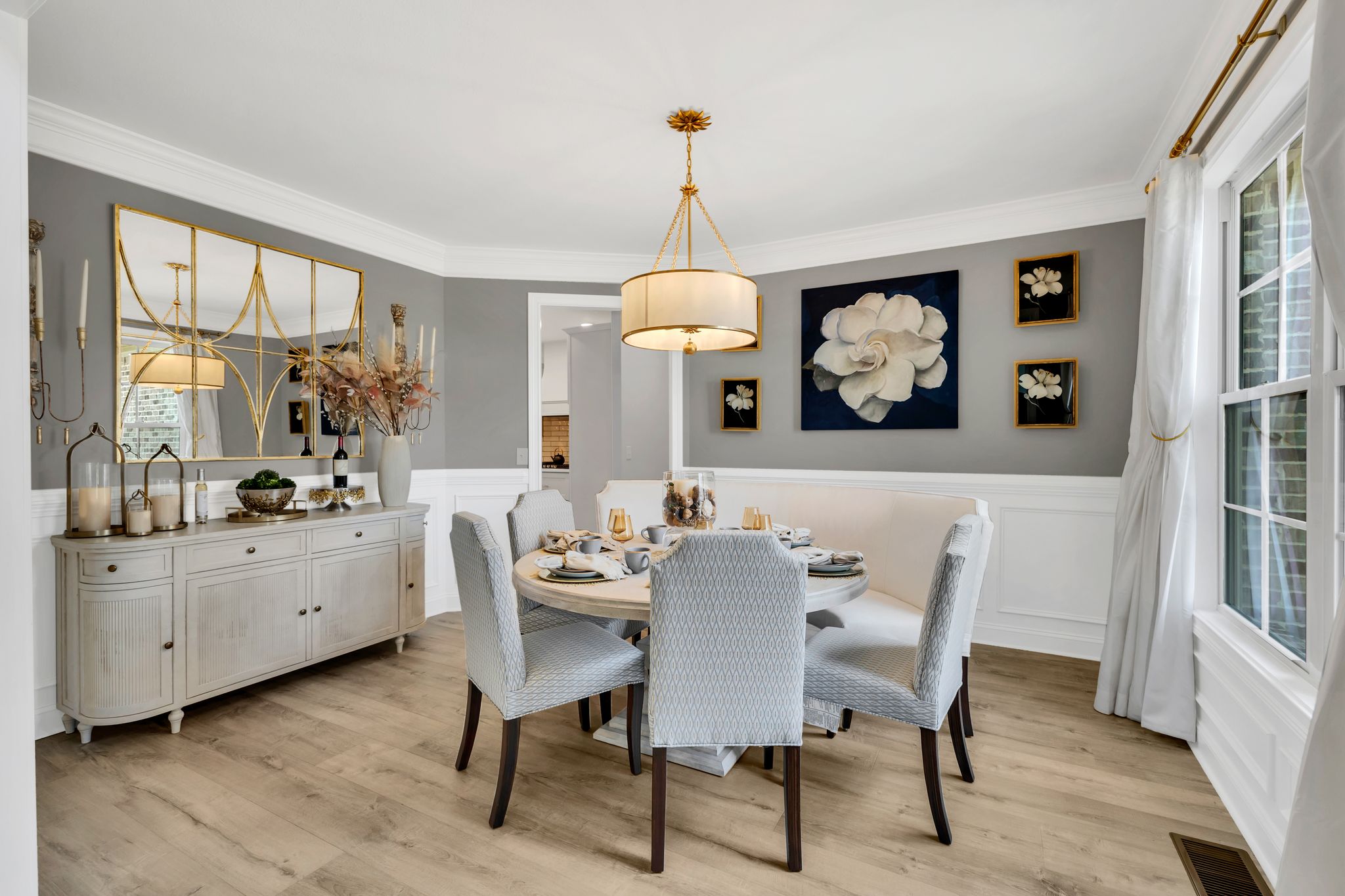 1484 Overlook Point Clarksville, TN 37043 - Photo 12 of 53 a dining room with wooden floor a chandelier a wooden table and chairs