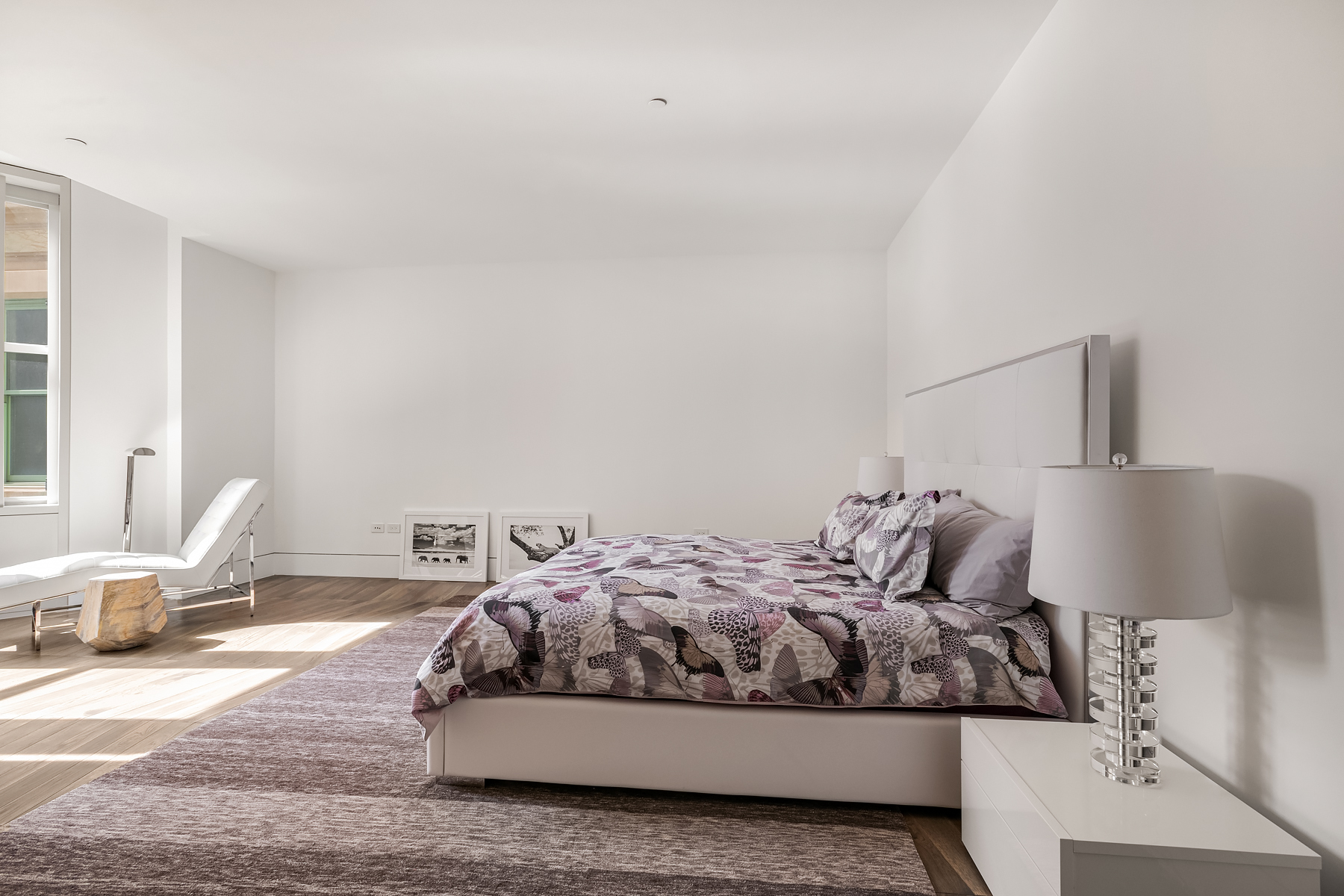 49 Chambers Street, Unit 15B Manhattan, NY 10007 - Photo 5 of 20 a bedroom with a bed and chair