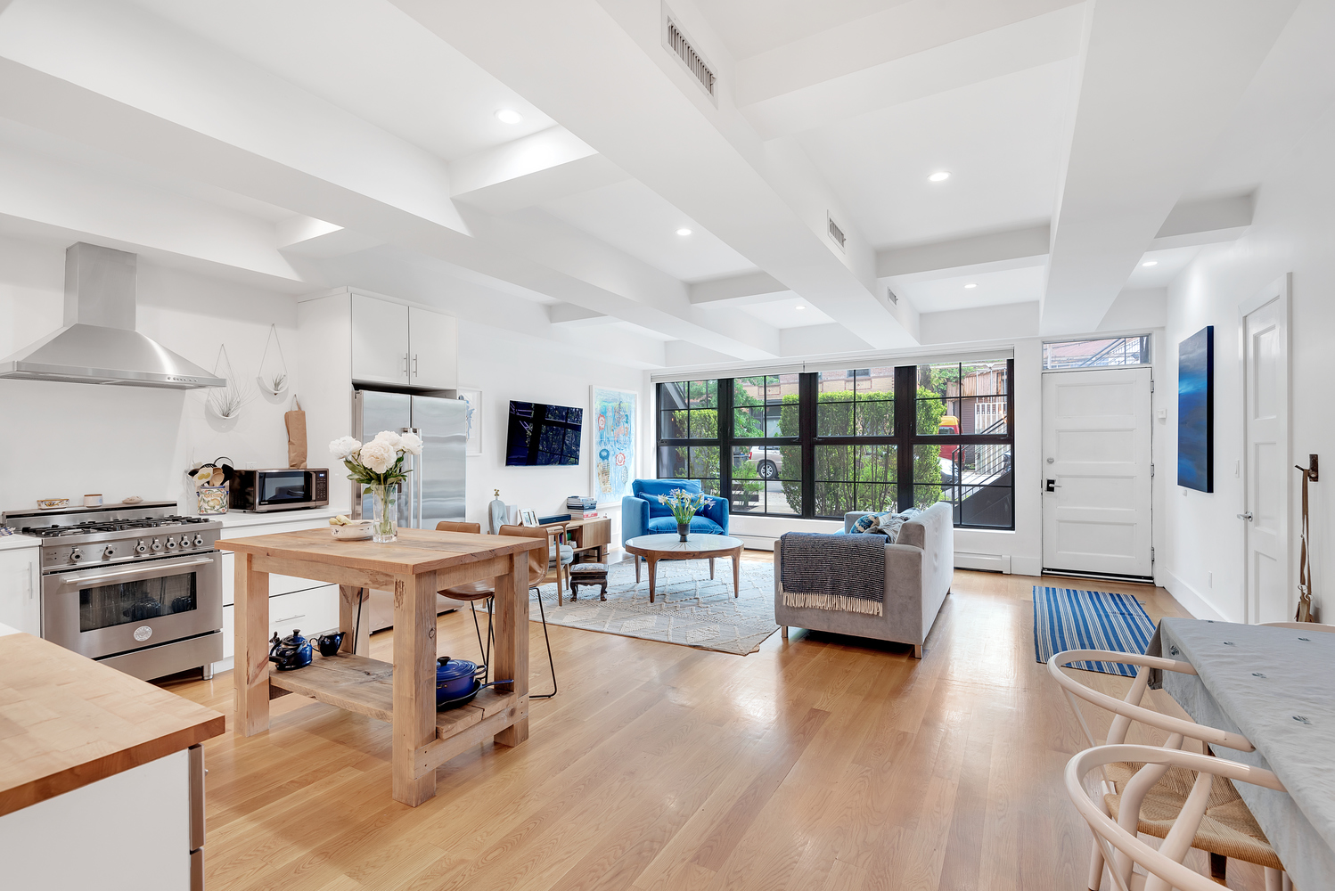 49 Summit Street, Unit 1C Brooklyn, NY 11231 - Photo 1 of 10 a living room with furniture and wooden floor