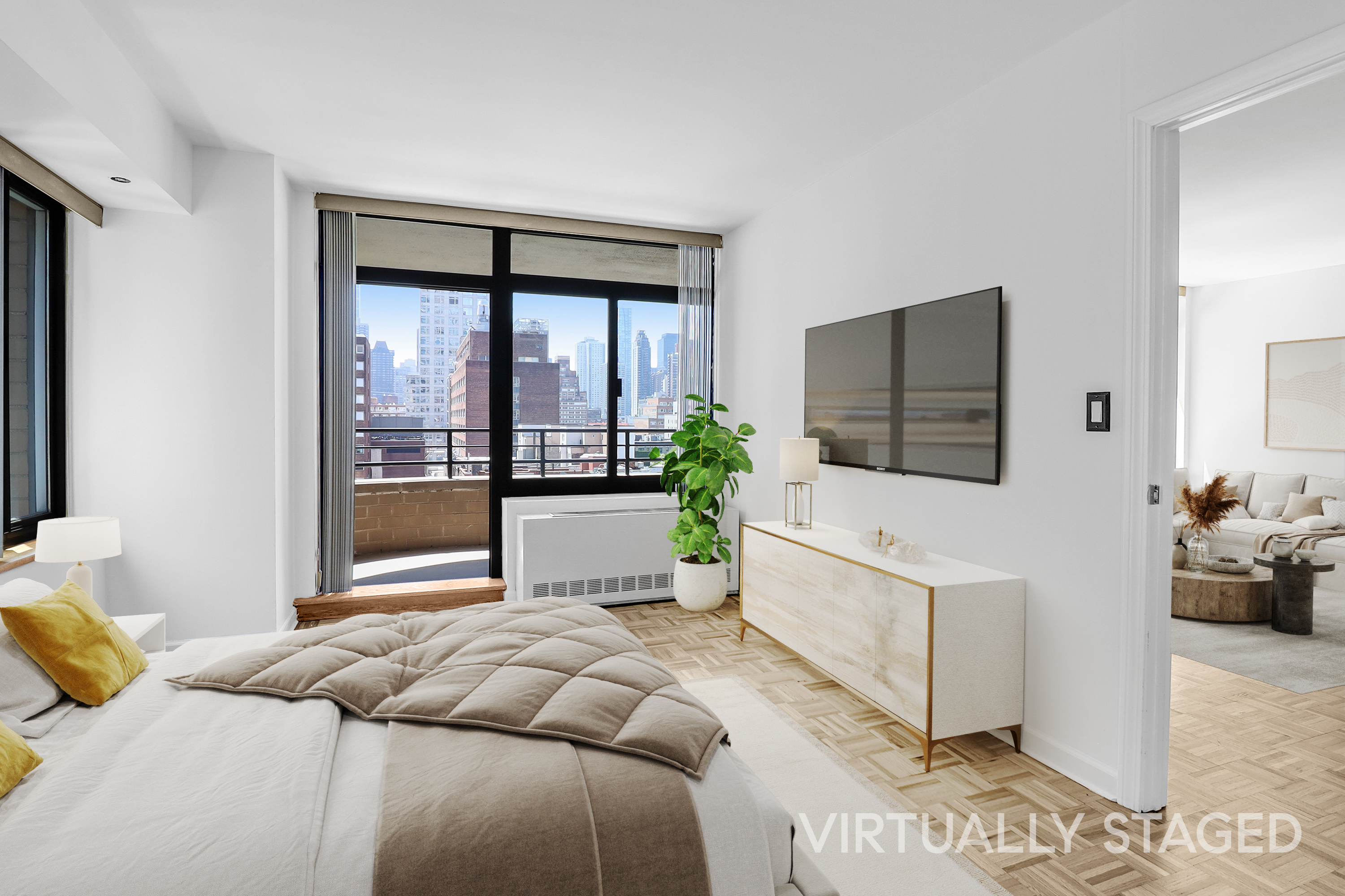 400 East 70th Street, Unit 1008 Manhattan, NY 10021 - Photo 6 of 15 a bedroom with a large bed and a flat tv screen