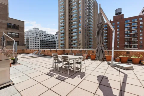 a view of a patio with a bench