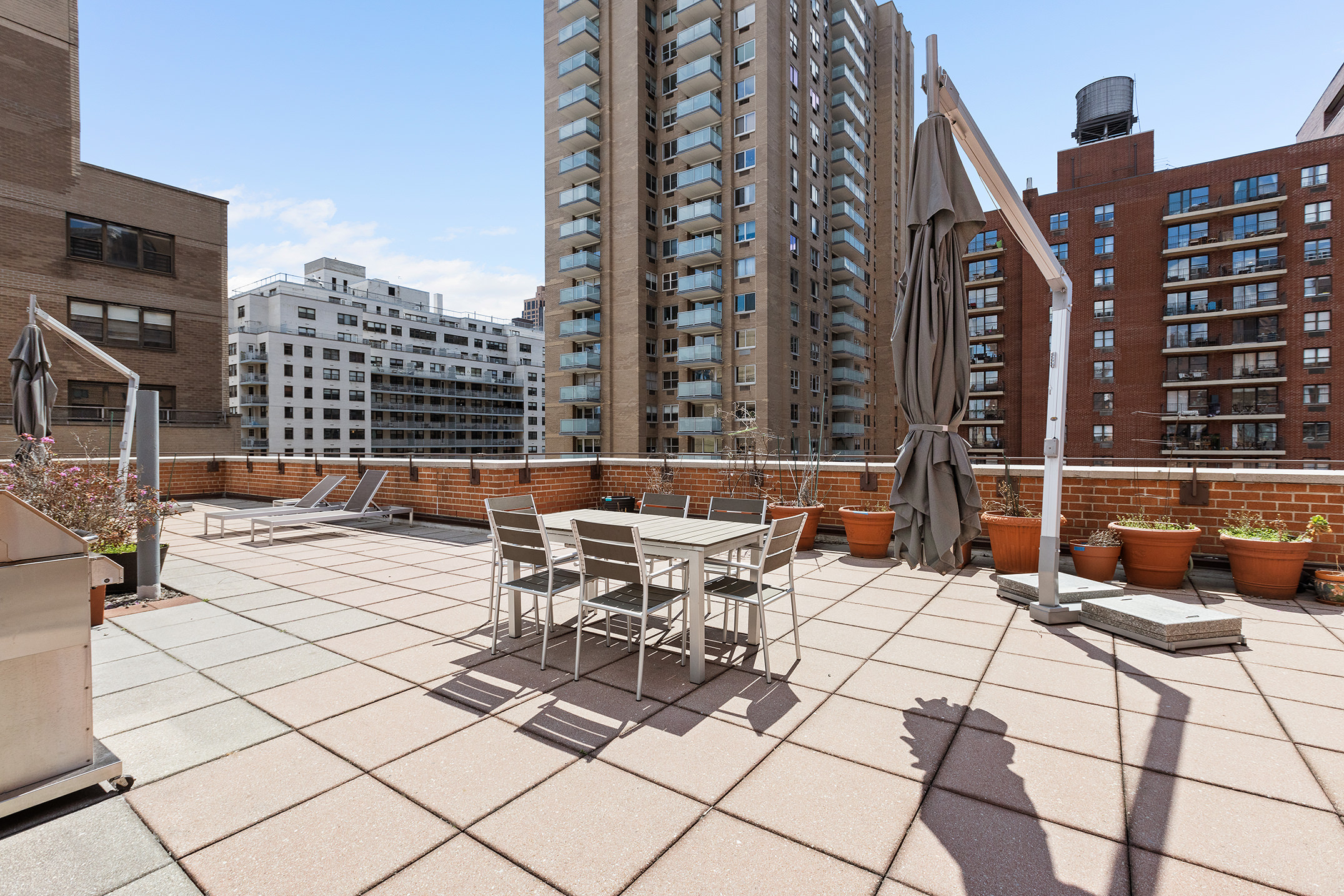 235 East 87th Street, Unit 5G Manhattan, NY 10128 - Photo 9 of 13 a view of a patio with a bench