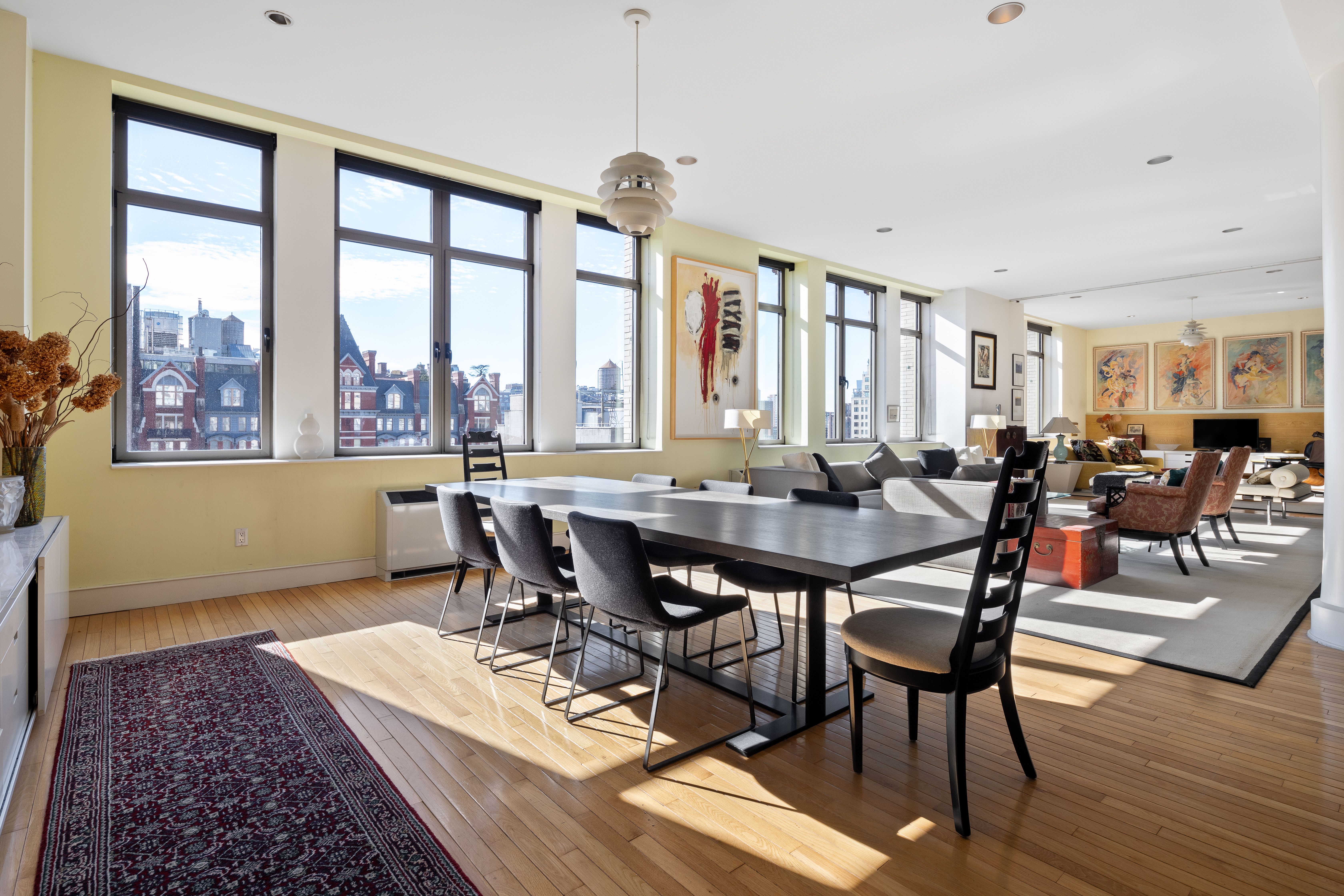 252 7th Avenue, Unit 9X Manhattan, NY 10001 - Photo 3 of 26 a view of a dining room with furniture window and wooden floor