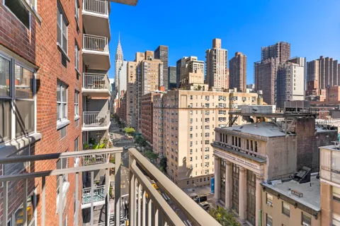 a view of buildings from a balcony