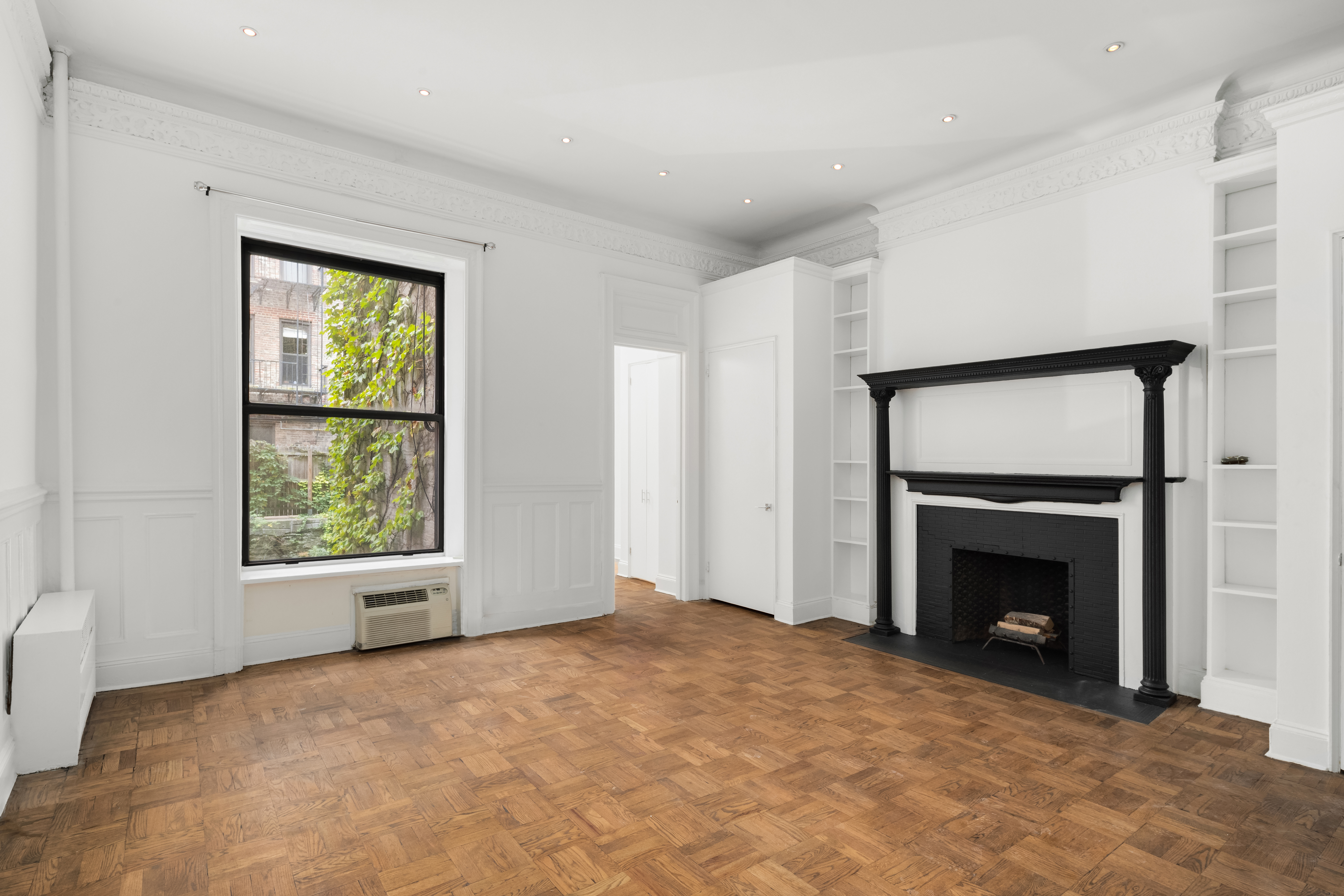a view of an empty room with a window