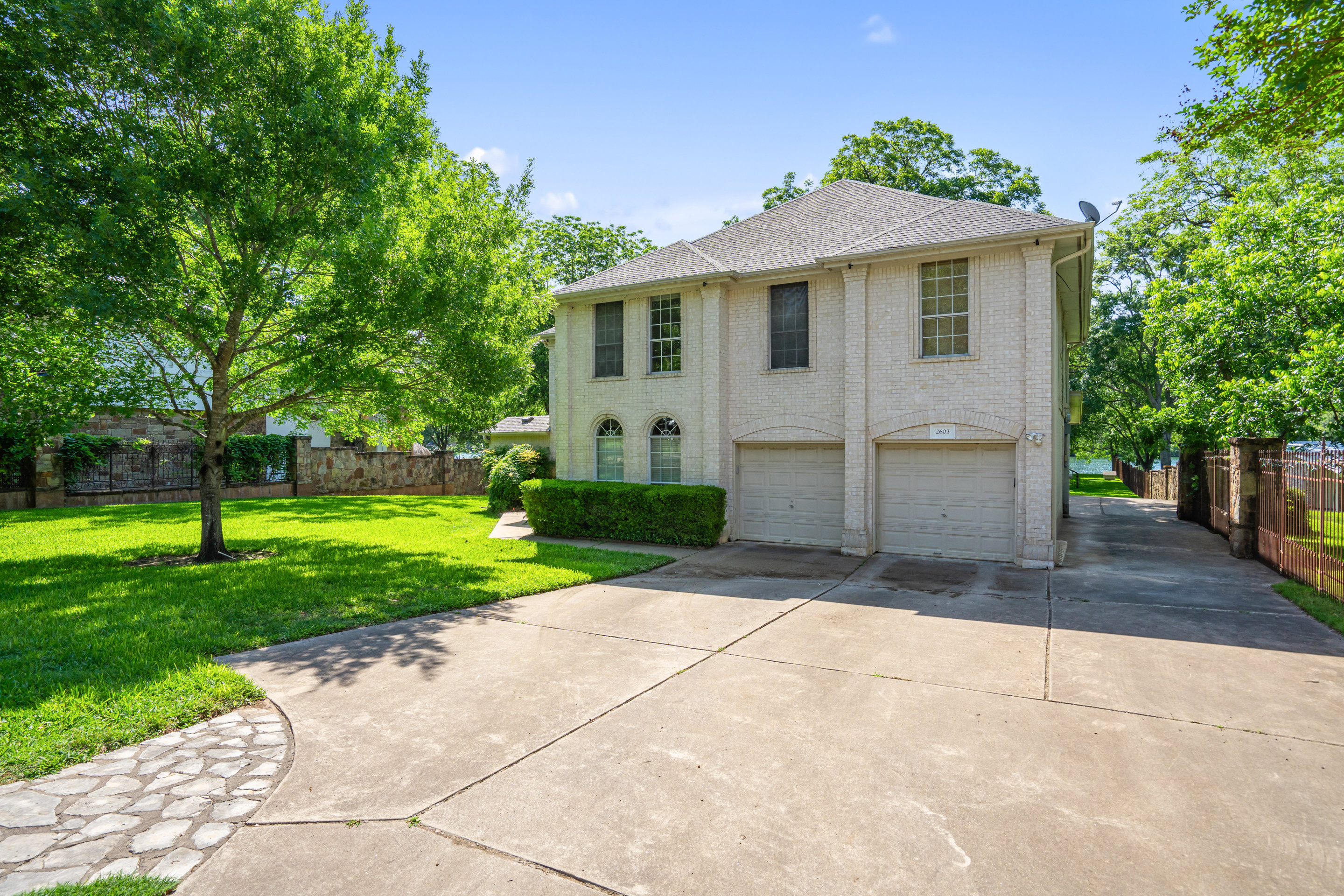 2603 Pearce Road Austin, TX 78730 - Photo 30 of 41 a front view of a house with a yard