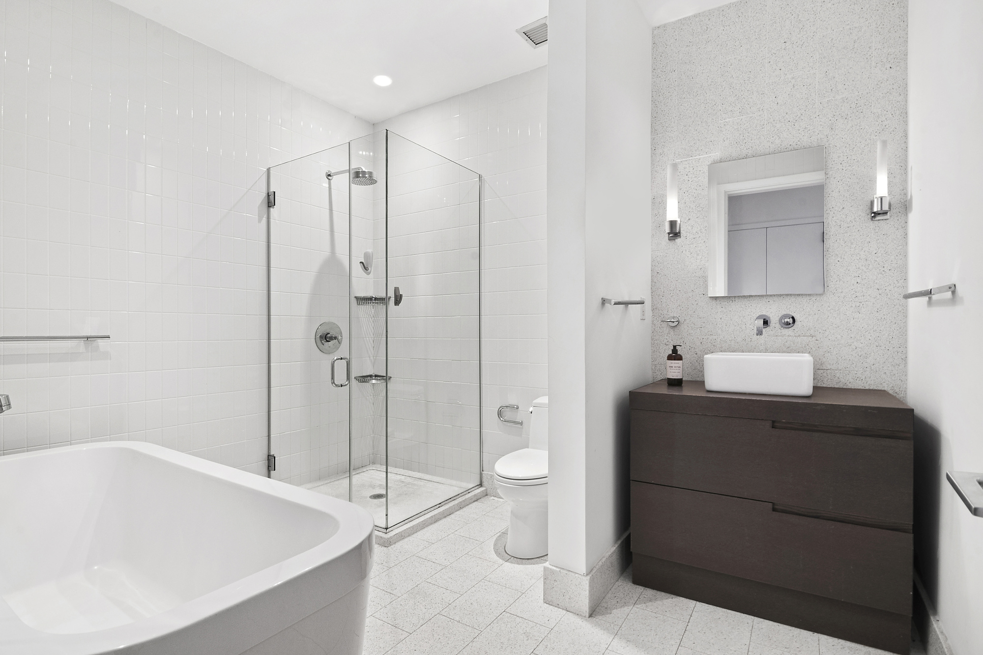 360 Furman Street, Unit 320/321 Brooklyn, NY 11201 - Photo 17 of 28 a bathroom with a bathtub shower sink mirror and toilet