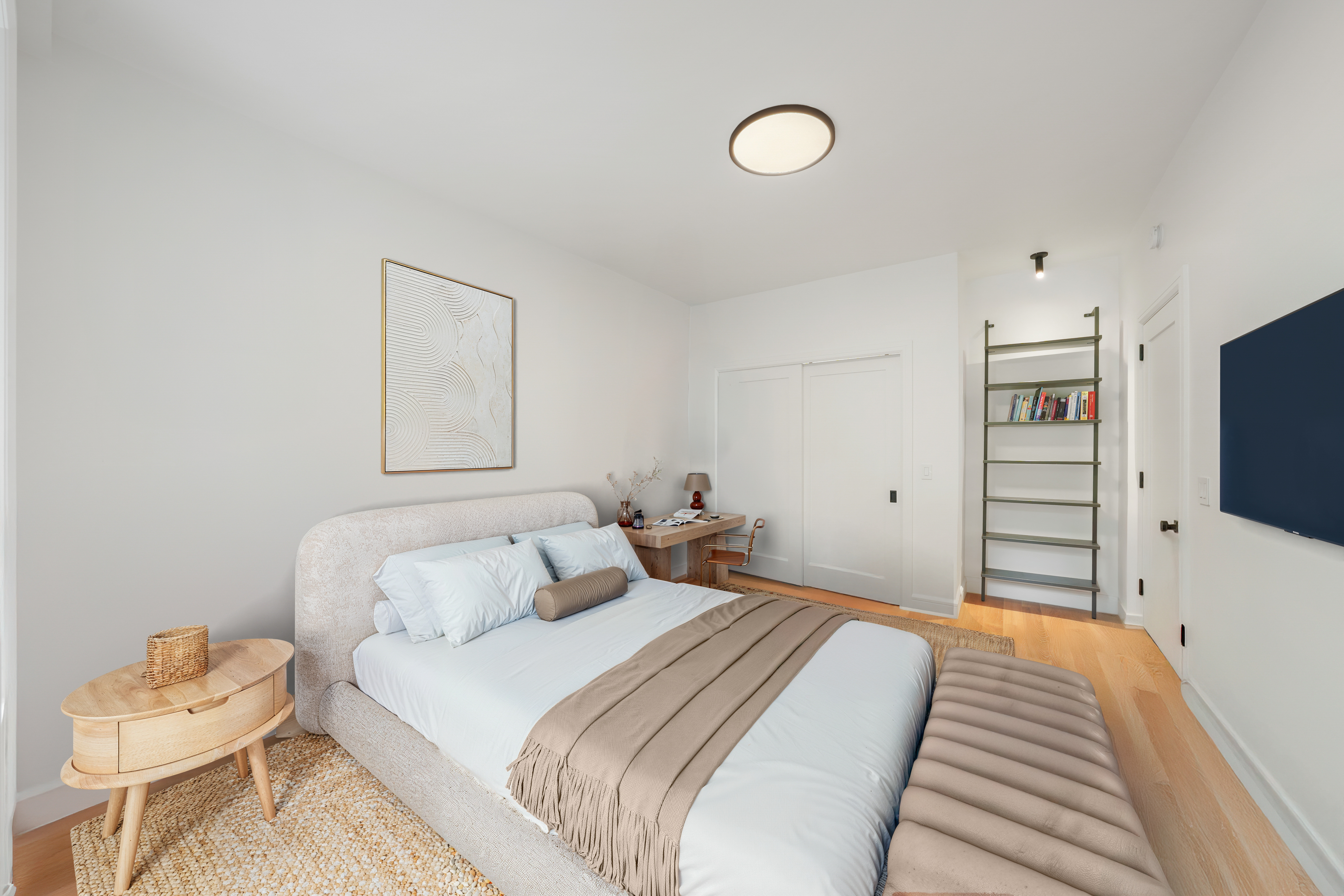 176 West 87th Street, Unit 1H Manhattan, NY 10024 - Photo 10 of 19 a bedroom with a bed and a flat screen tv