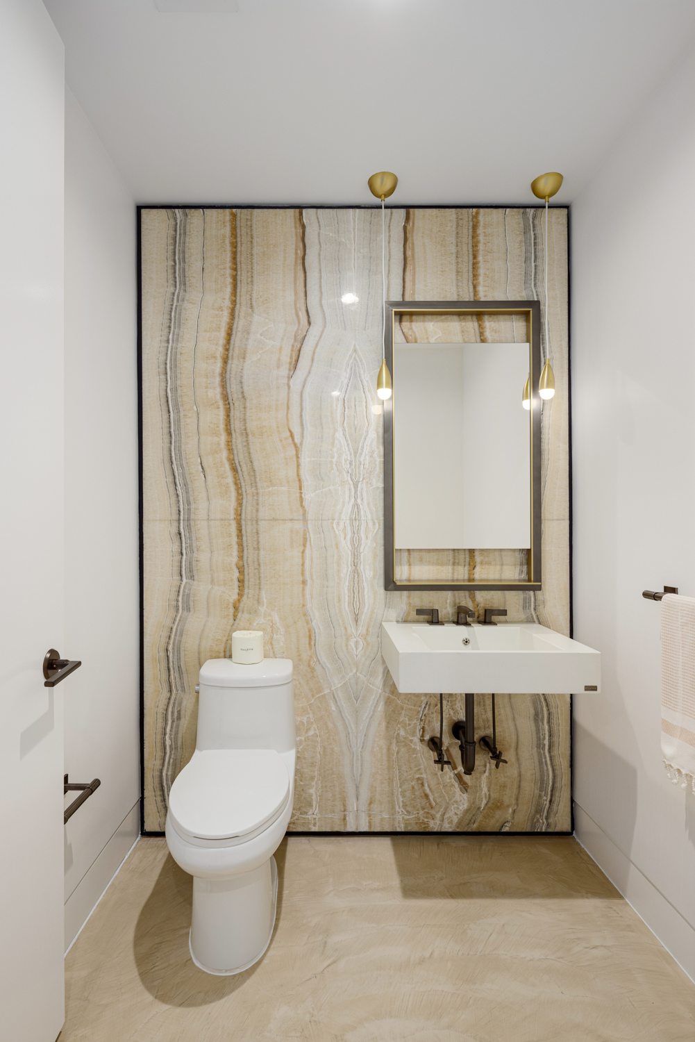 91 Leonard Street, Unit 4A Manhattan, NY 10013 - Photo 10 of 22 a bathroom with a toilet sink and mirror