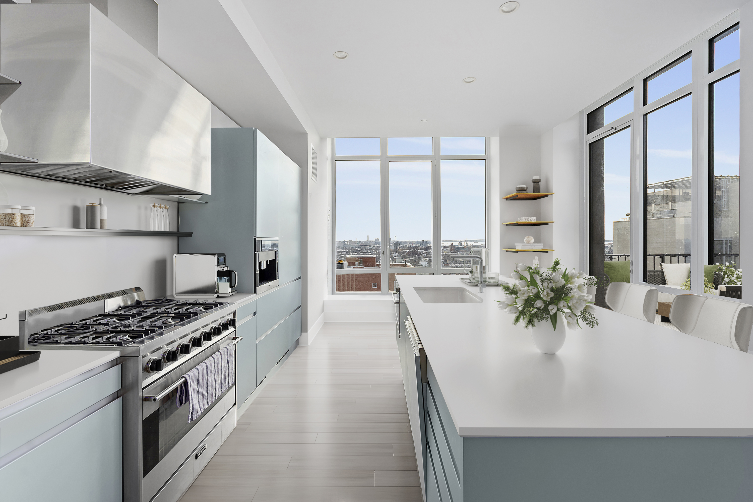 265 State Street, Unit 1601 Brooklyn, NY 11201 - Photo 4 of 14 a kitchen with a stove a sink and a refrigerator