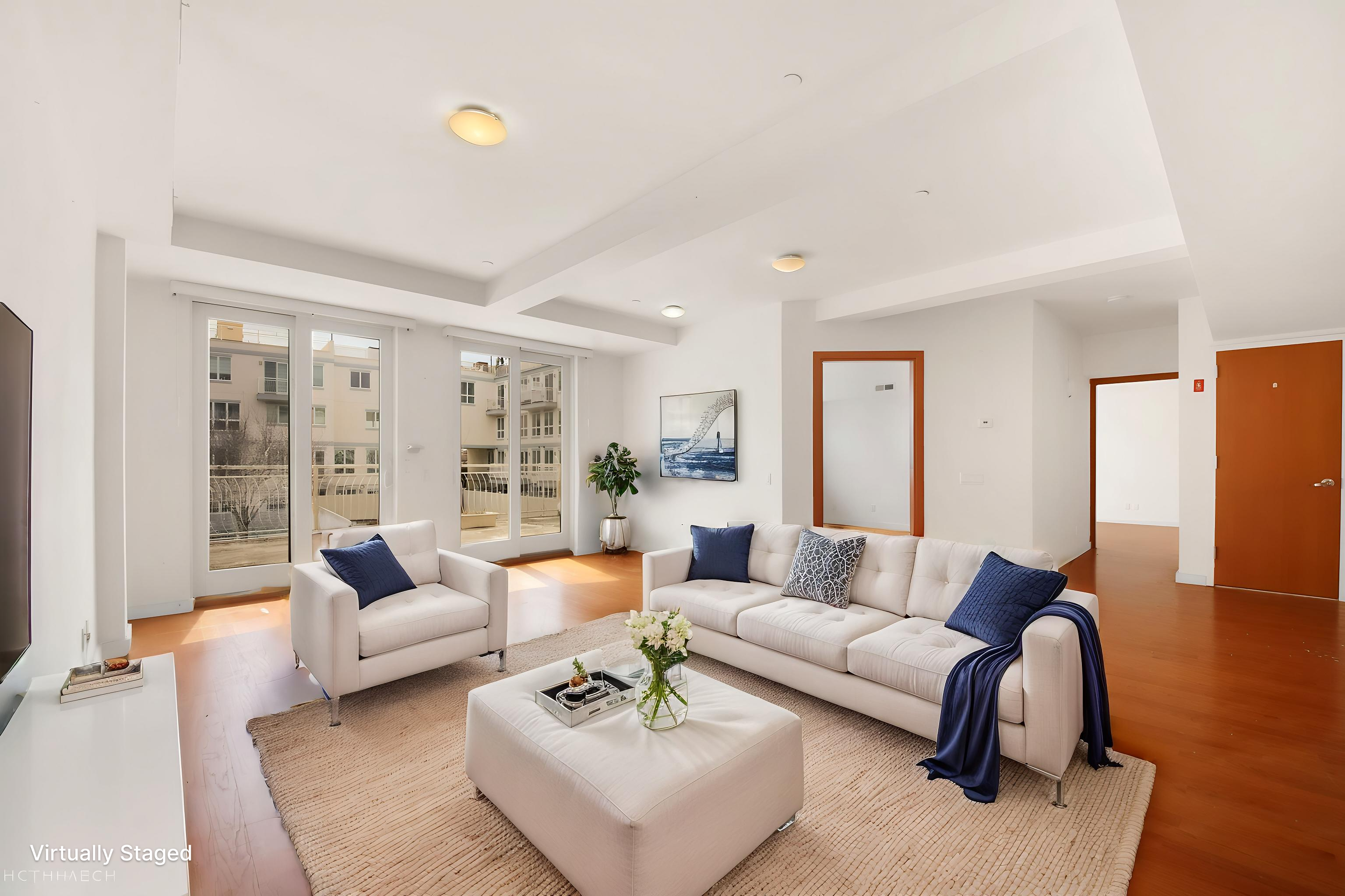 3112 Emmons Avenue, Unit 107 Brooklyn, NY 11235 - Photo 2 of 14 a living room with furniture and a large window