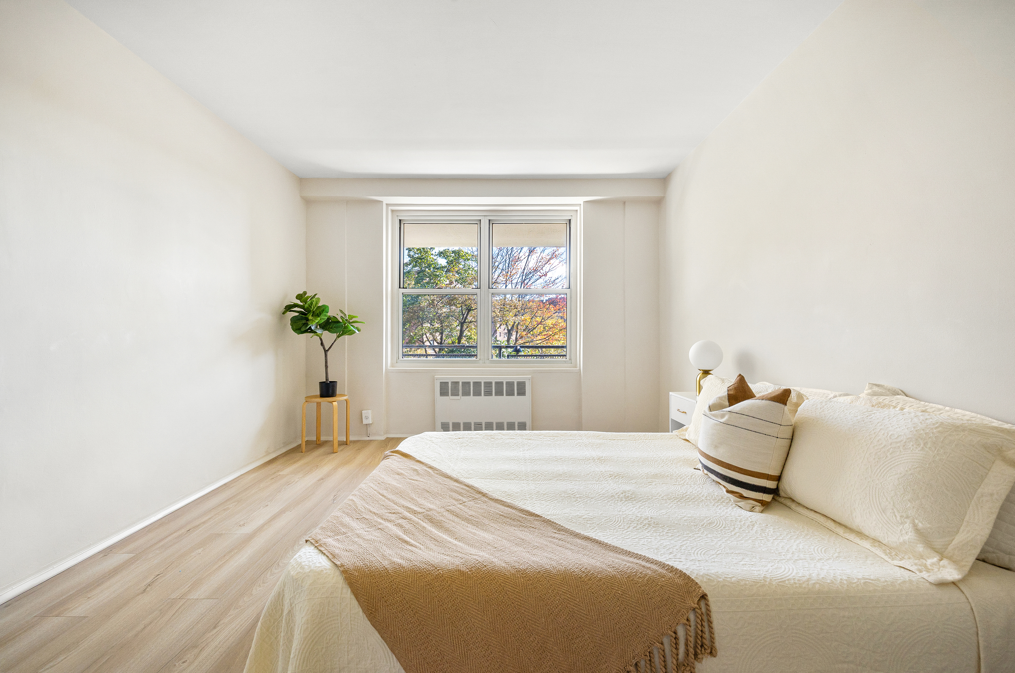 35-51 85th Street, Unit 4M Queens, NY 11372 - Photo 7 of 10 a bedroom with a bed and window