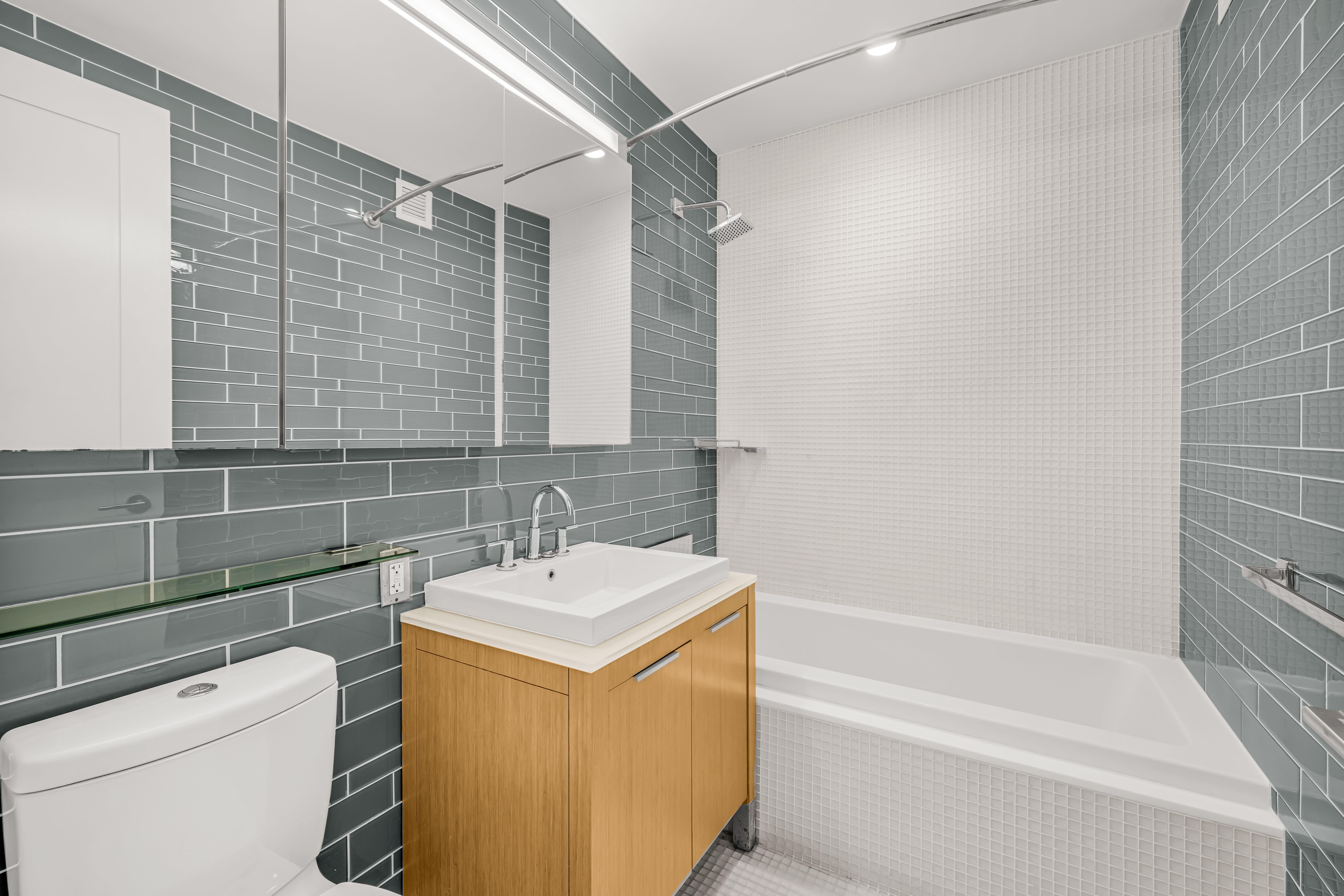 34 North 7th Street, Unit 3Z Brooklyn, NY 11249 - Photo 6 of 14 a bathroom with a sink a toilet and shower