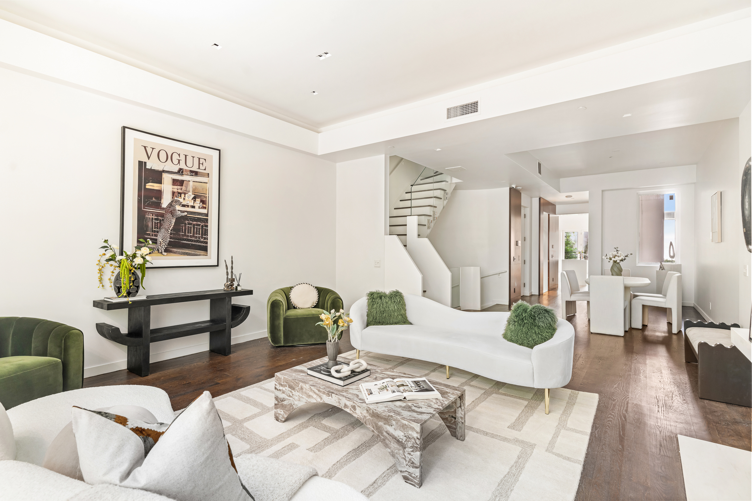 135 East 38th Street Manhattan, NY 10016 - Photo 6 of 32 a living room with furniture and wooden floor