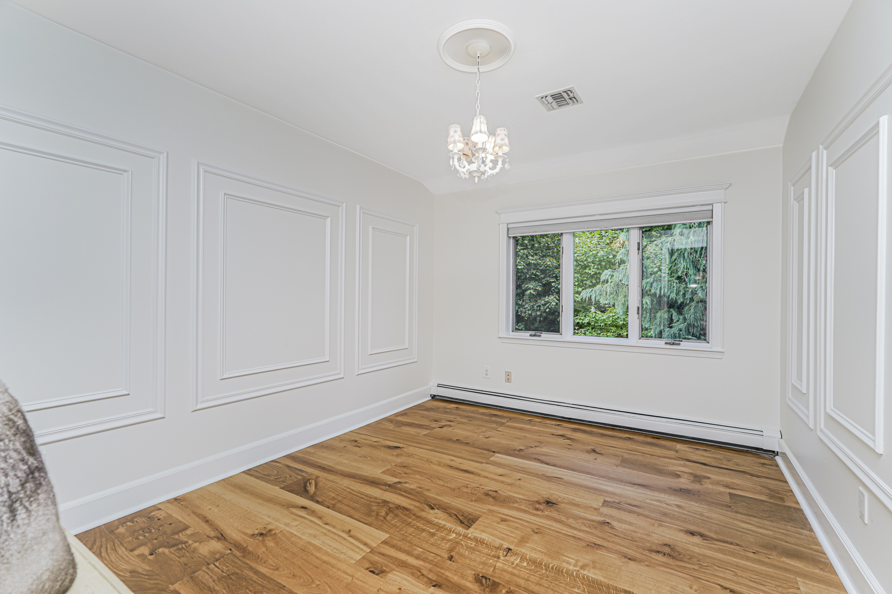 165 Swaim Avenue Staten Island, NY 10312 - Photo 17 of 45 a view of empty room with wooden floor and fan