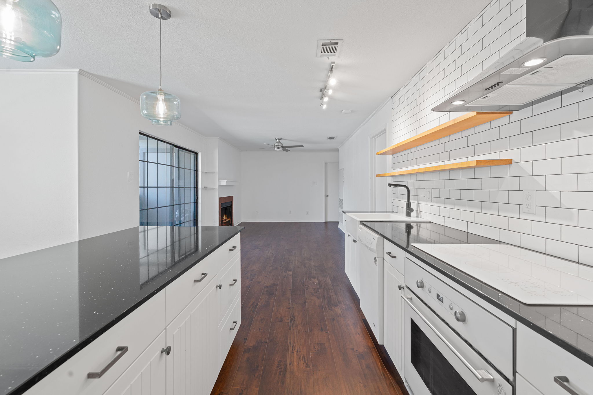 1510 West N Loop Boulevard, Unit 424 Austin, TX 78756 - Photo 6 of 25 a large white kitchen with a large window