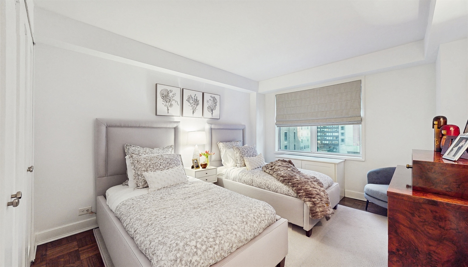 136 East 56th Street, Unit 16B Manhattan, NY 10022 - Photo 8 of 11 a bedroom with two beds and a couch