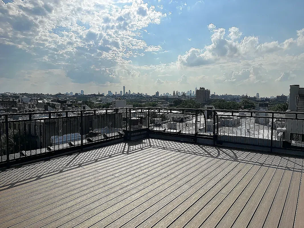 285 Cornelia Street, Unit 2R Brooklyn, NY 11221 - Photo 7 of 11 a view of a balcony with wooden floor