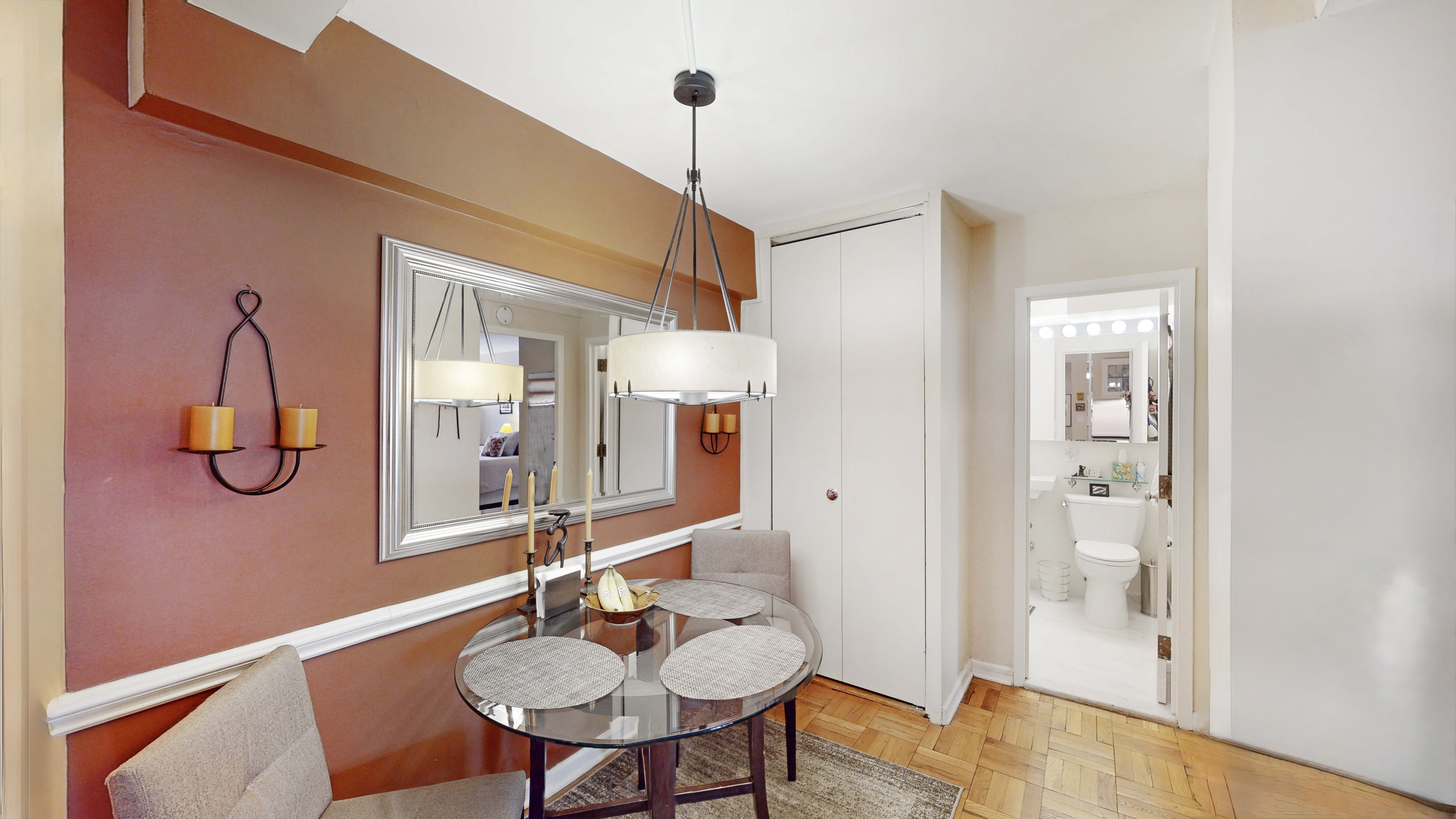 515 East 85th Street, Unit 6A Manhattan, NY 10028 - Photo 5 of 11 a dining room with furniture and wooden floor