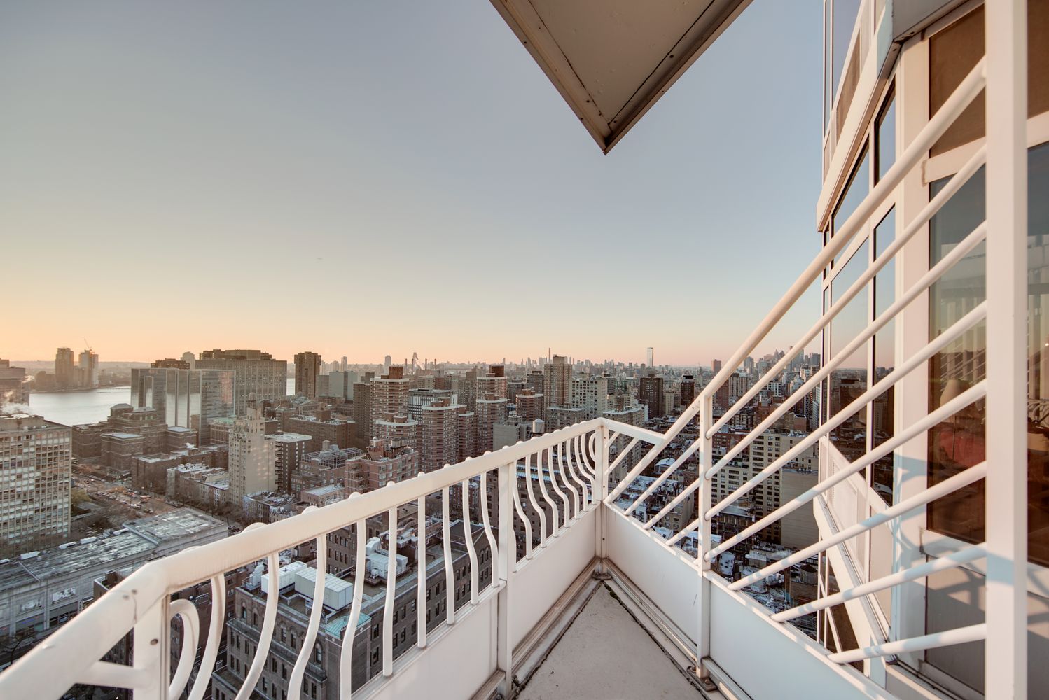 a view of a balcony with city
