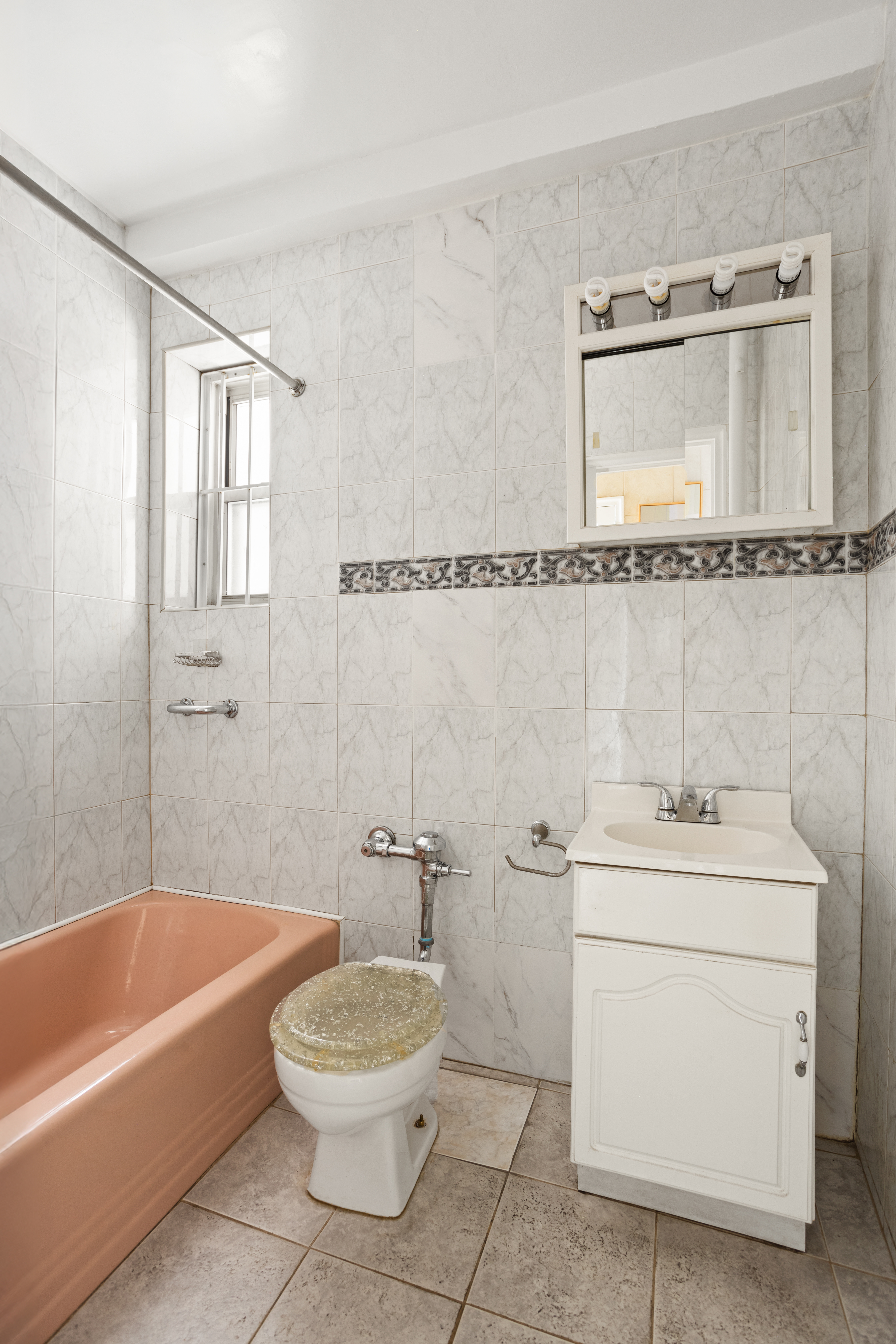 61-41 Saunders Street, Unit A18 Queens, NY 11374 - Photo 5 of 11 a bathroom with a sink a toilet and a bathtub