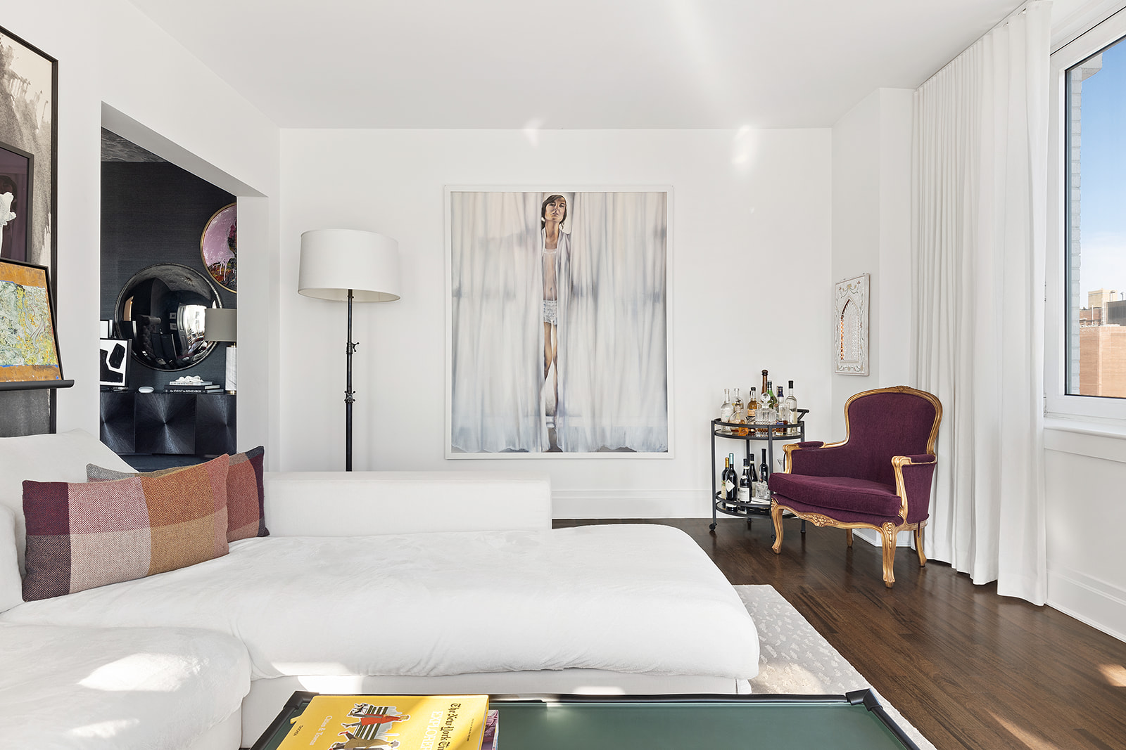 300 East 77th Street, Unit 18C Manhattan, NY 10075 - Photo 2 of 12 a living room with furniture and a chair