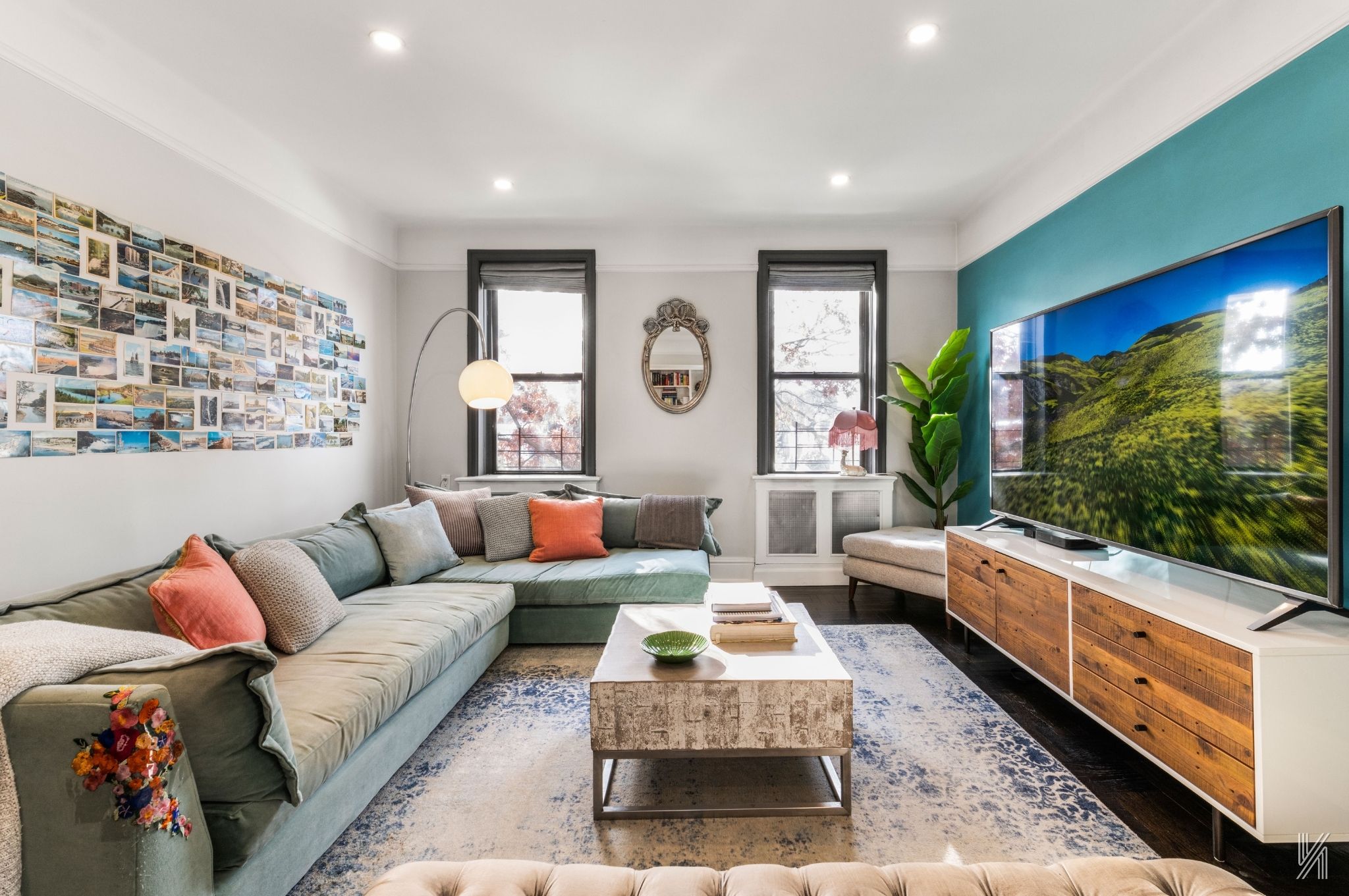 35-06 88th Street, Unit 3G Queens, NY 11372 - Photo 2 of 20 a living room with furniture and a flat screen tv